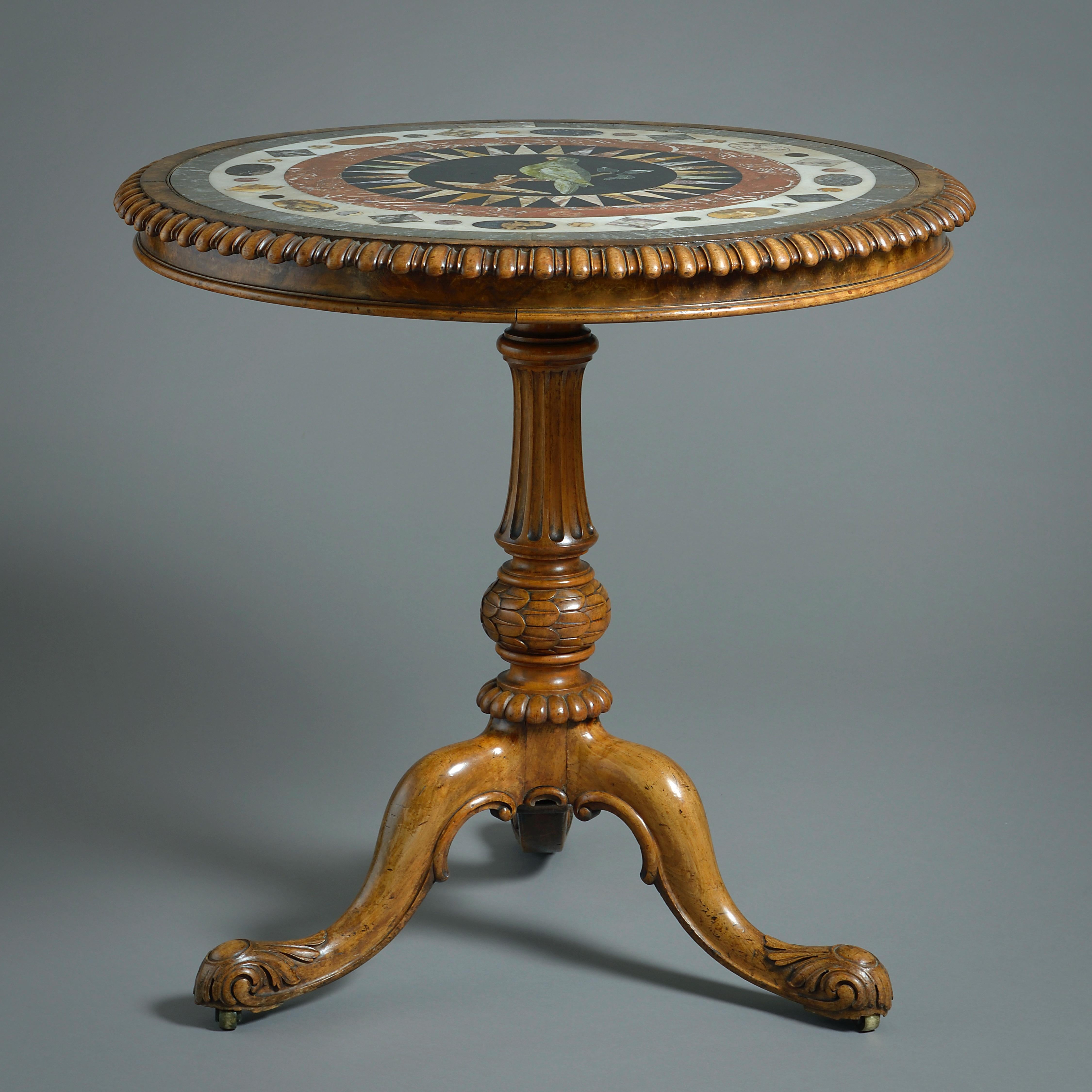 A FINE WILLIAM IV PIETRA DURA AND WALNUT CENTRE TABLE ATTRIBUTED TO GILLOWS, CIRCA 1835.

The inset top geometrically inlaid with various marbles around a central roundel of a green parrot on a branch.