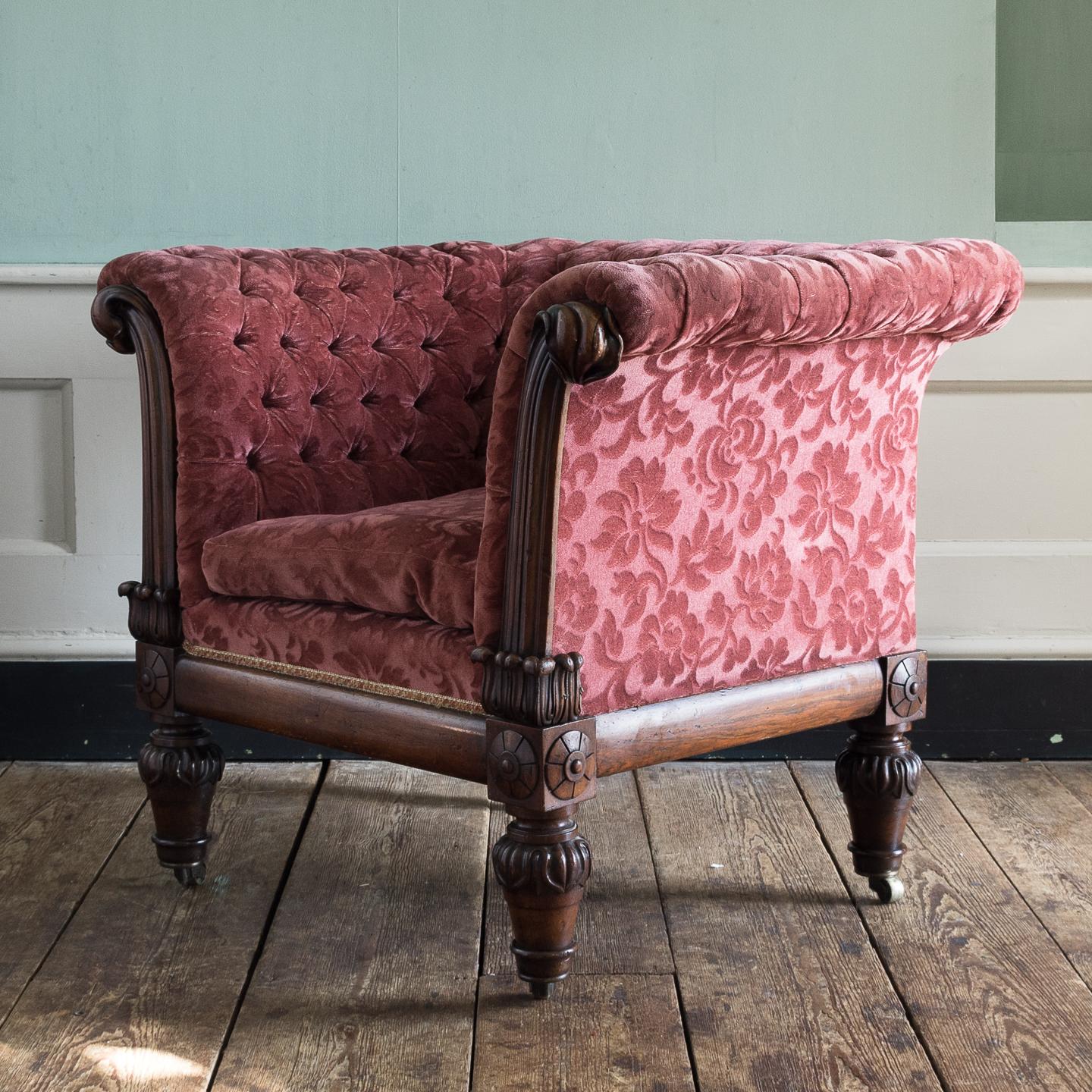 A substantial William IV period rosewood framed armchair, with velvet button back upholstery and squab cushion.

This large and imposing armchair has upholstery that whilst not being new is in thoroughly acceptable order. There is some very slight