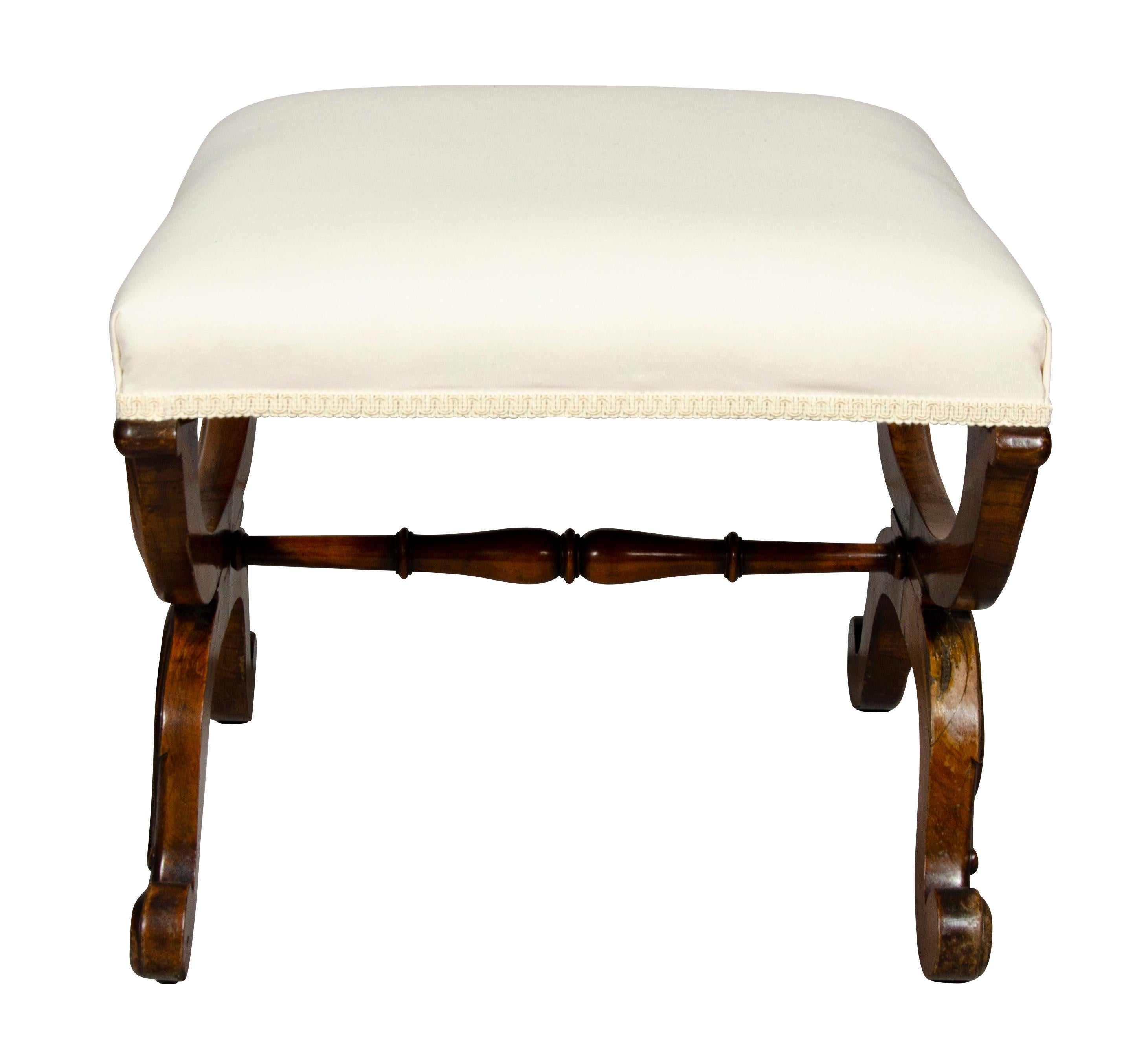 Square newly upholstered in muslin seat with carved X form legs with scroll feet, turned stretcher.