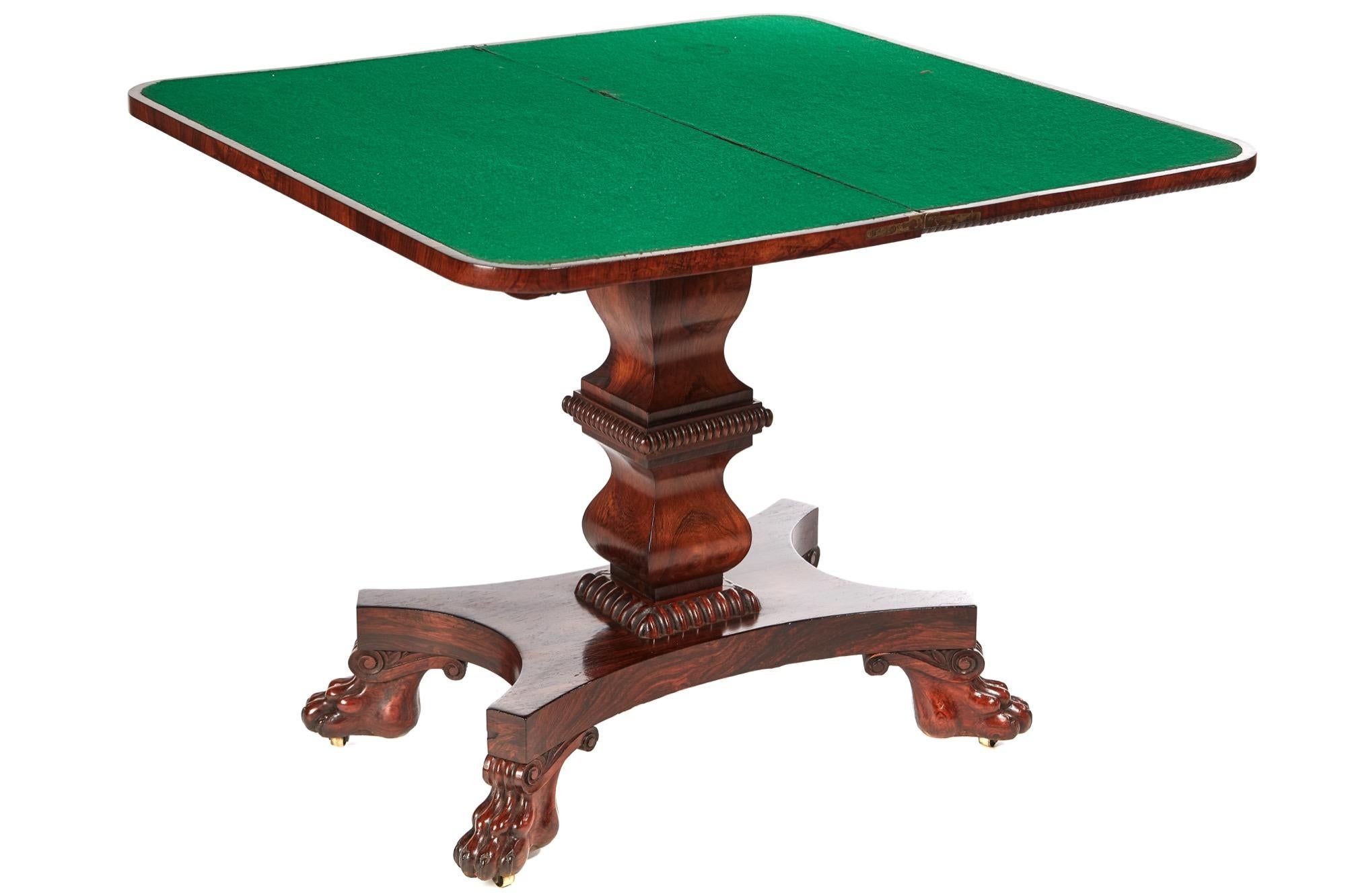 Fine William IV rosewood card table with a fantastic figured rosewood top that lifts up and swivels to reveal a green baize interior, super carved frieze supported by a lovely shaped figured rosewood pedestal, finishing on a quatrefoil base with