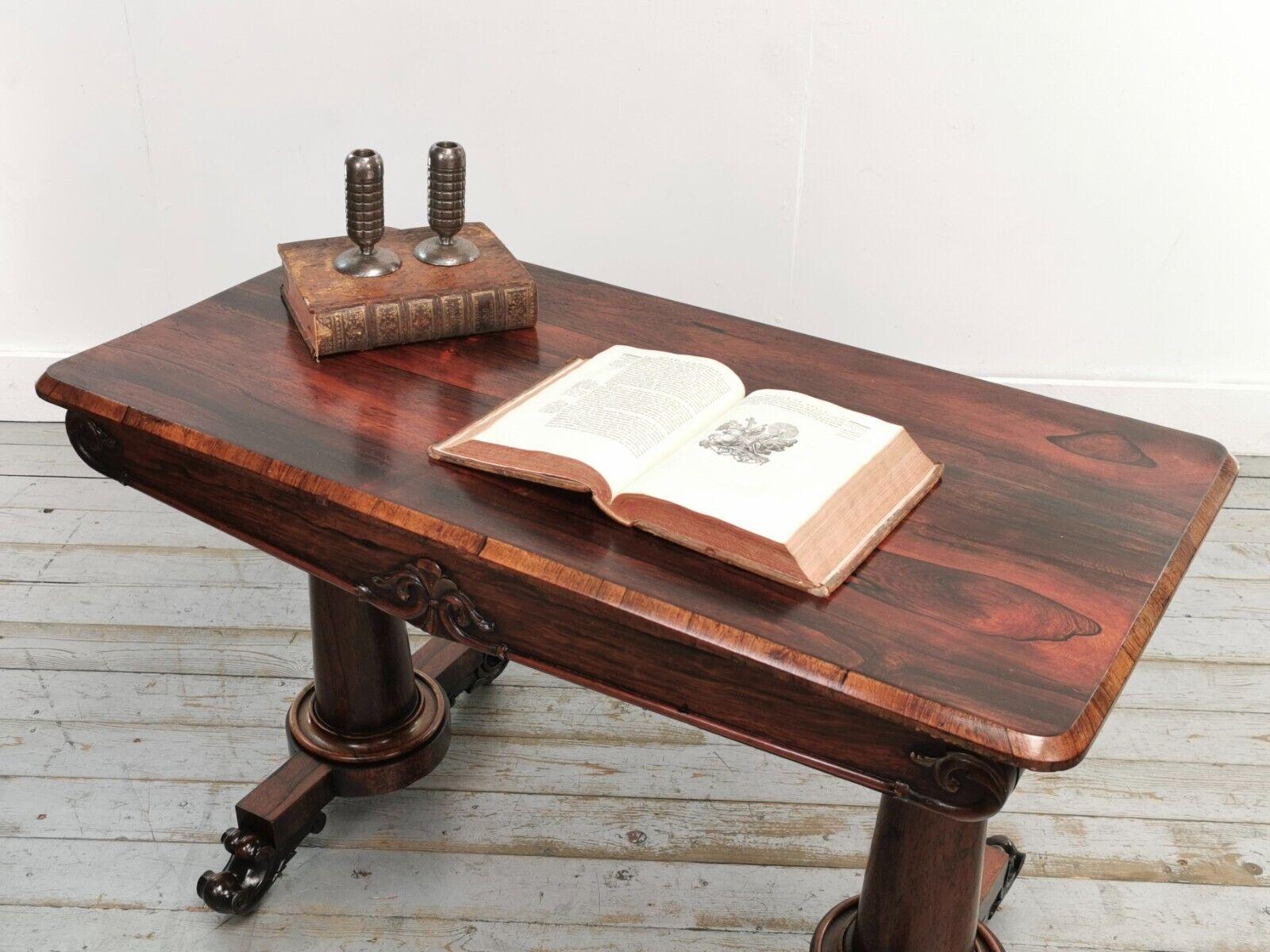 Early 19th century, William IV, Ornate Rosewood Library table on scrolling brass feet above castors with a large drawer to the front.

This high-quality piece has a really beautiful deep Rosewood colour and patina and is in excellent condition for