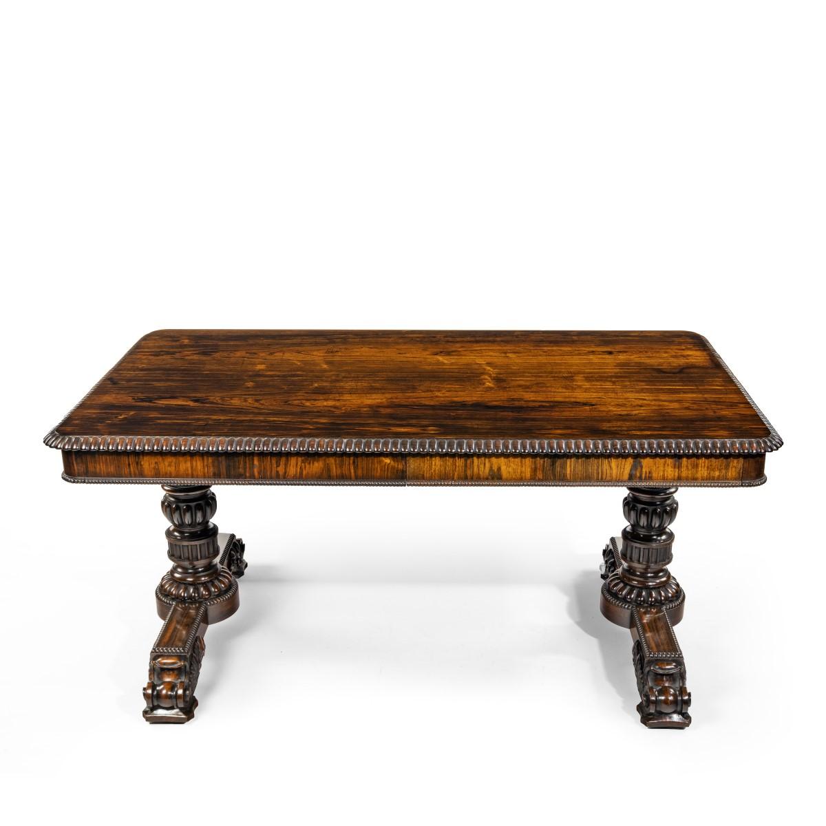 A William IV rosewood partners’ library table by Gillows, the rectangular flame-veneered top with rounded corners and gadrooned edging, the frieze with two disguised drawers on either side, English, circa 1830.

 

See Susan E Stuart ‘Gillows of