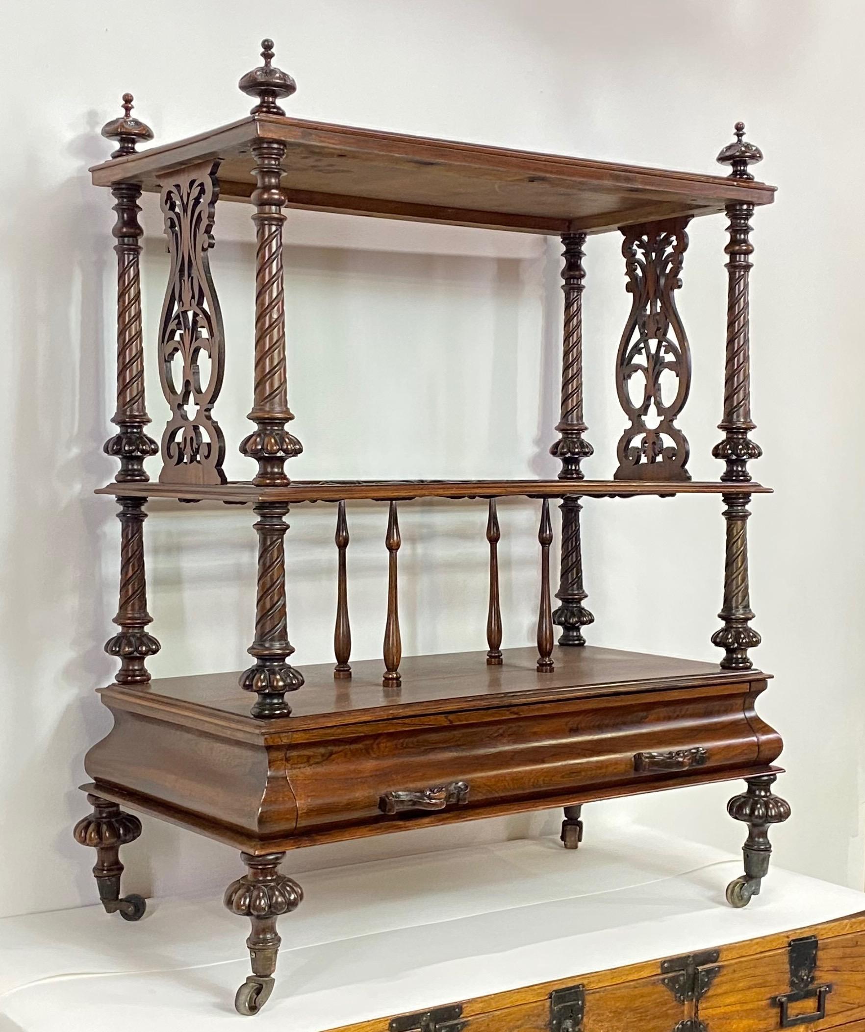 William IV English rosewood sheet music Canterbury table in good original condition, circa 1835. This attractive and useful magazine rack (originally for music) has a table surface and lower bottom drawer.
Recently refurbished.


  