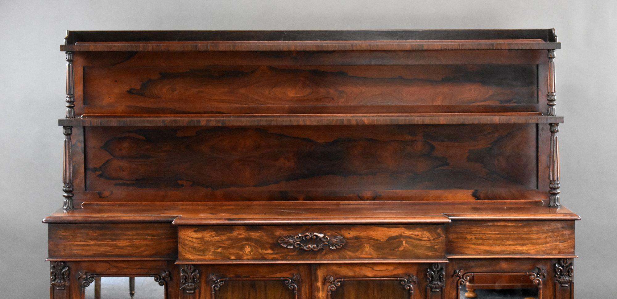 For sale is a good quality William IV rosewood sideboard, having a two tiered super structure supported by ornate columns, above three drawers with four cupboard doors below. Overall the sideboard is in very good condition showing minor signs of
