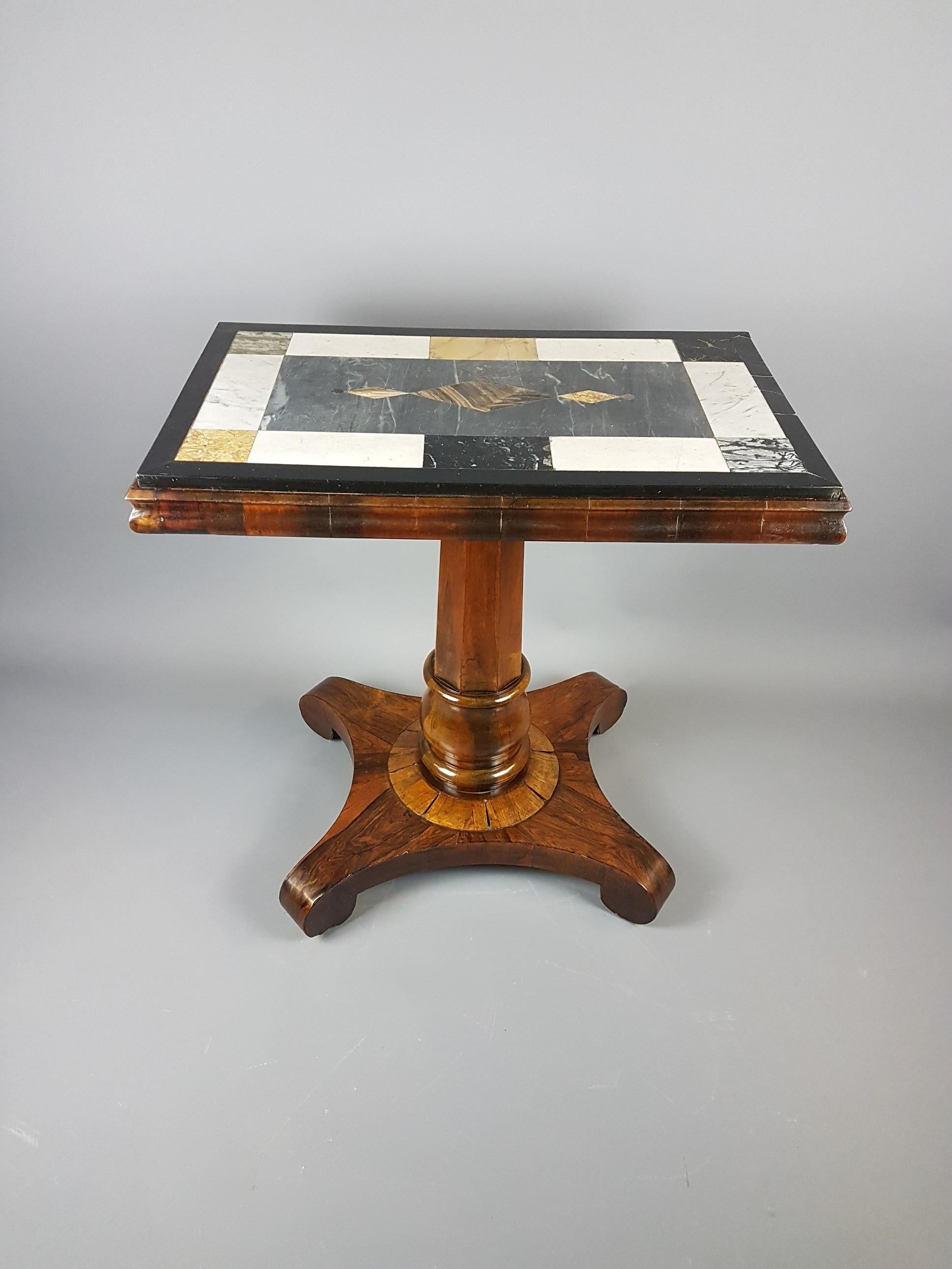 A great quality William IV centre table veneered in rosewood with a decorative specimen marble top. It is in good condition although has a few minor loses to the veneer at the base which is photographed. There is one section on the top that is