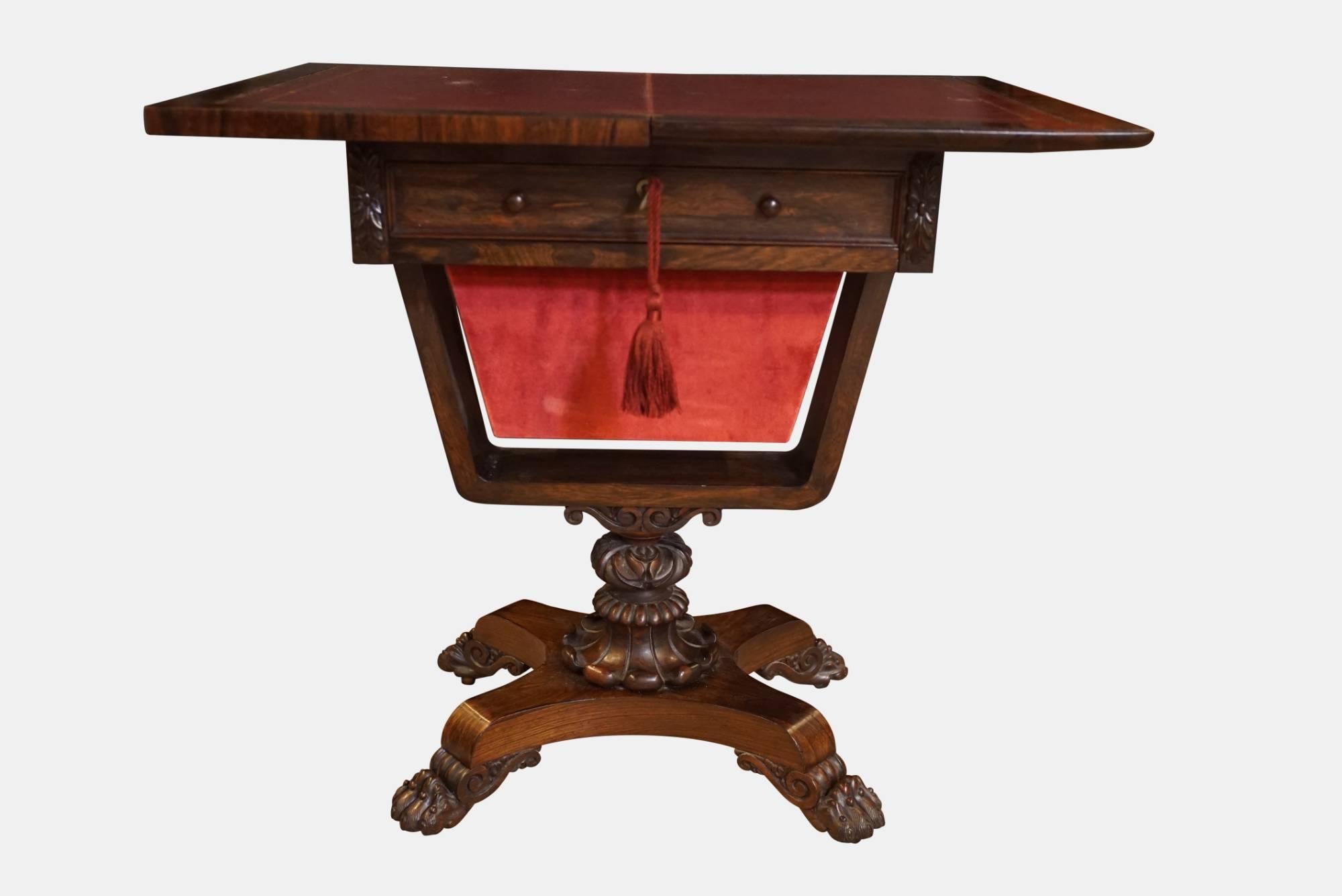 A William IV rosewood work/games/writing table standing on lions paw feet.


circa 1830.