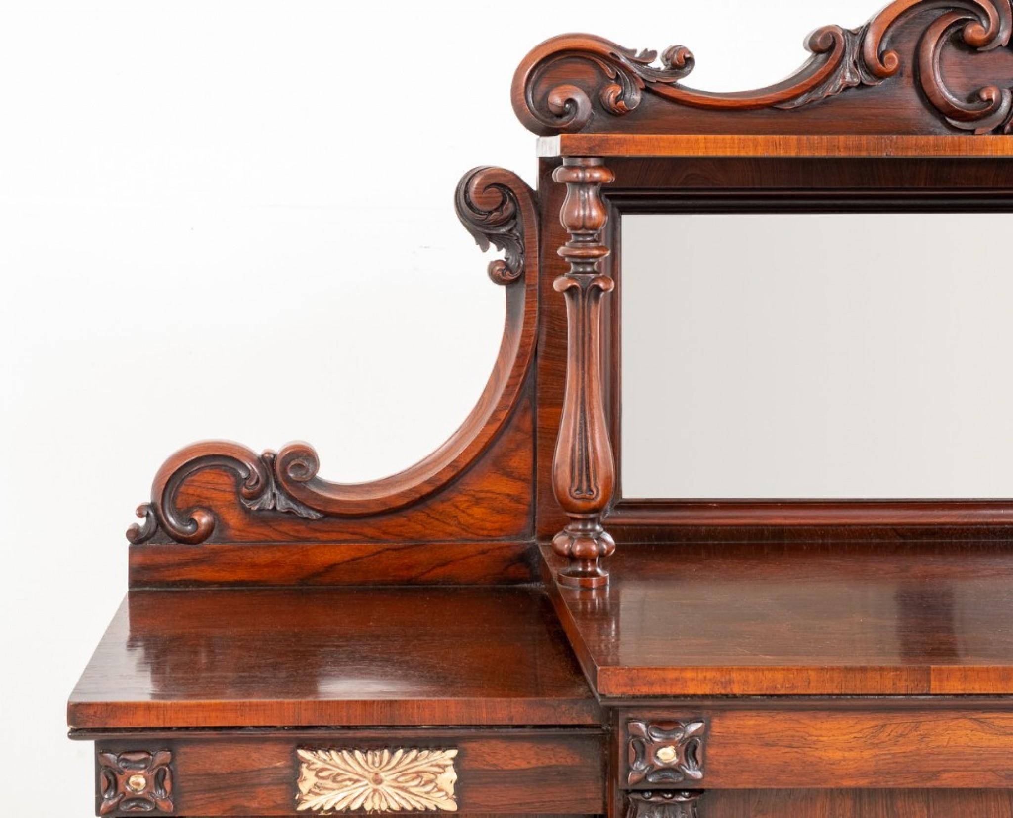 Impressive William IV rosewood side cabinet.
19th century
Raised upon a plinth base with 4 arched doors, each door having half turned mouldings.
The cabinet features turned columns with typical carved turnings to the tops and bottoms.
The
