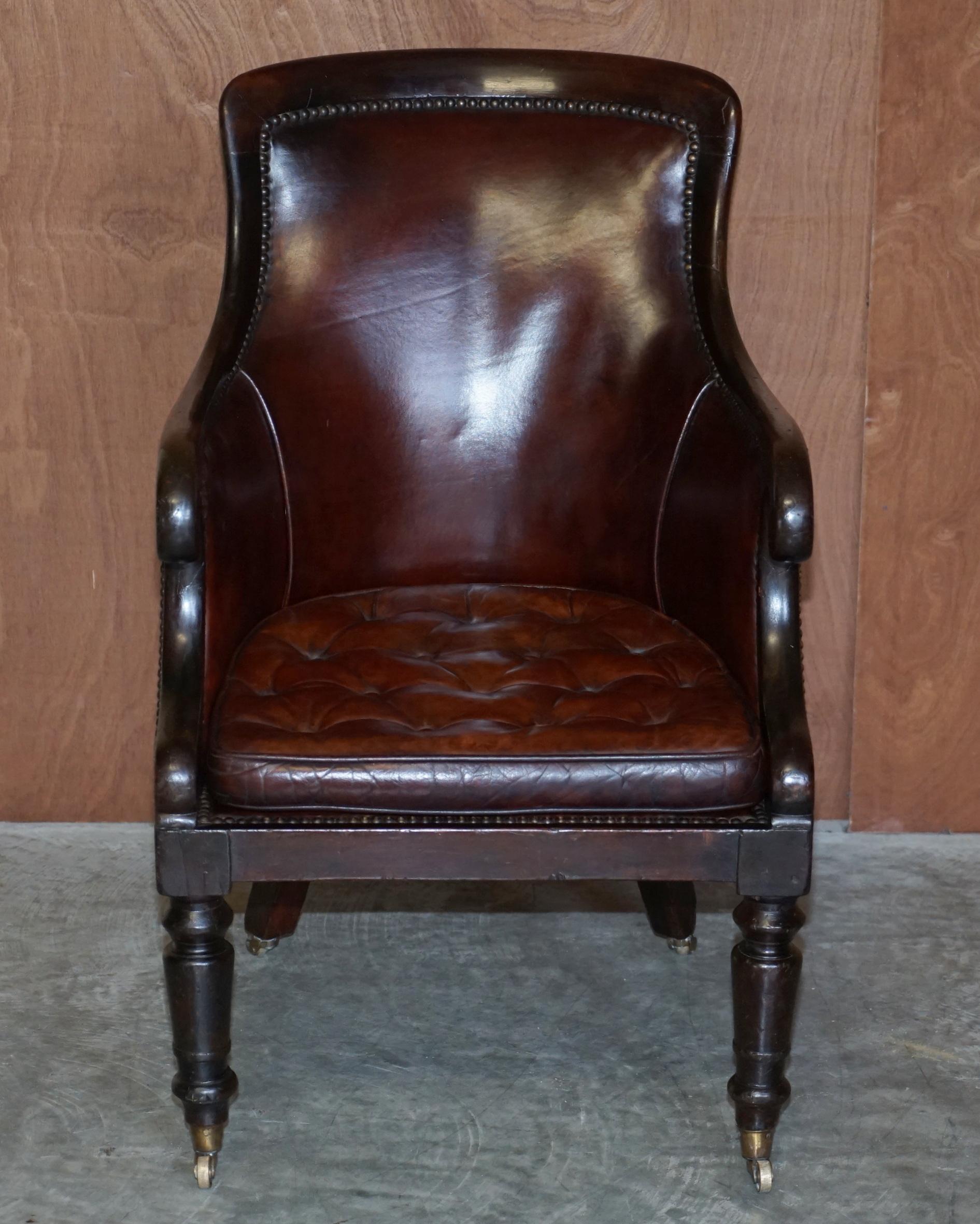 We are delighted to offer this stunning circa 1830 William IV mahogany and hand dyed brown leather library reading armchair with Thomas Chippendale floating button cushion

A good looking well made and decorative armchair, the frame is a luxury
