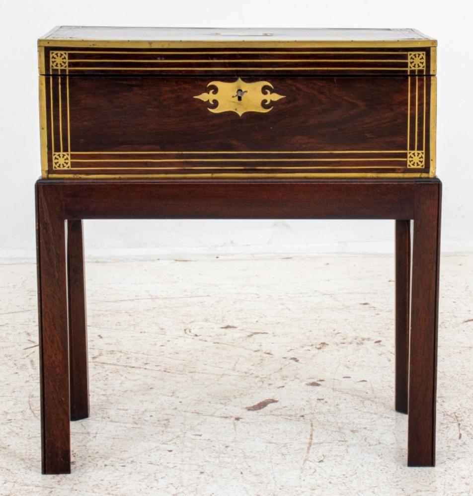 William IV or early Victorian lap desk on stand, the brass mounted rosewood with a cartouche engraved 