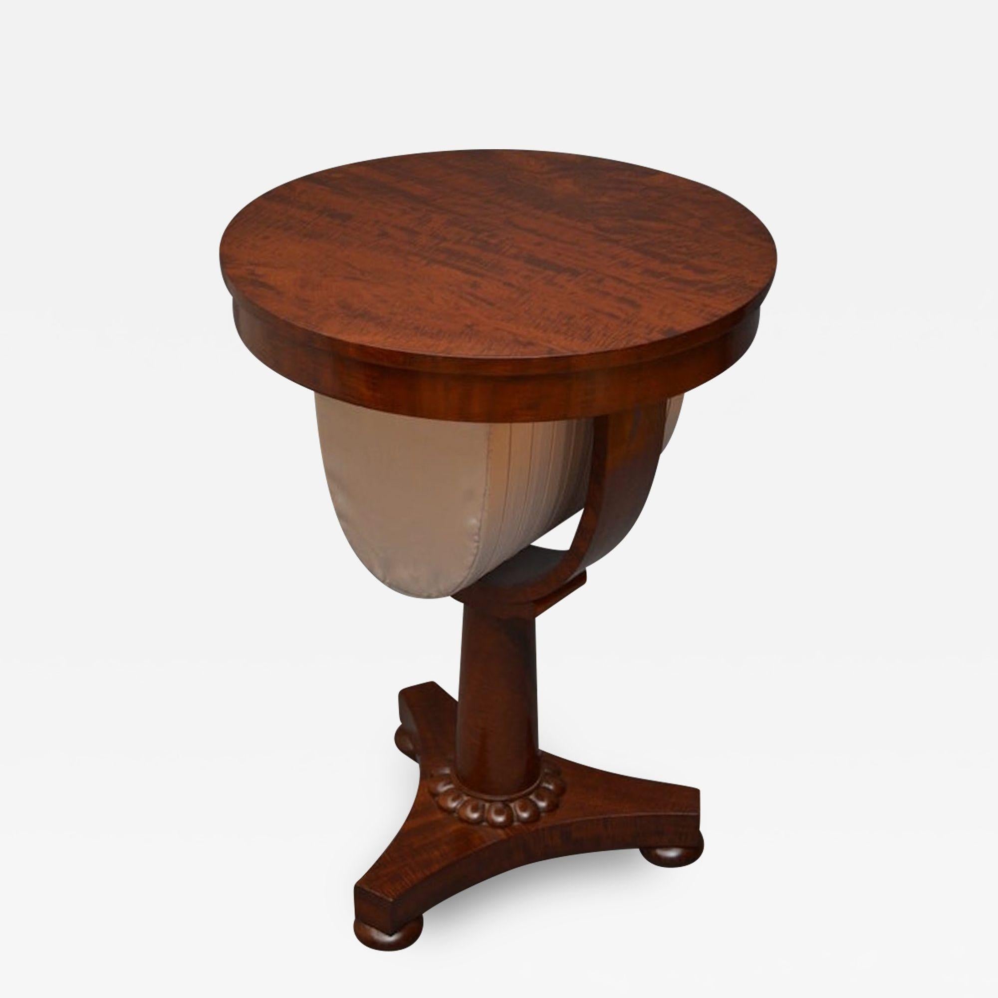 Sn765 Fine quality William IV mahogany work table, having circular top with single drawer to frieze and sewing bag below with pleated silk cover, stands on tapering cylinder pedestal with carved collar and platform base terminating in bun feet. All