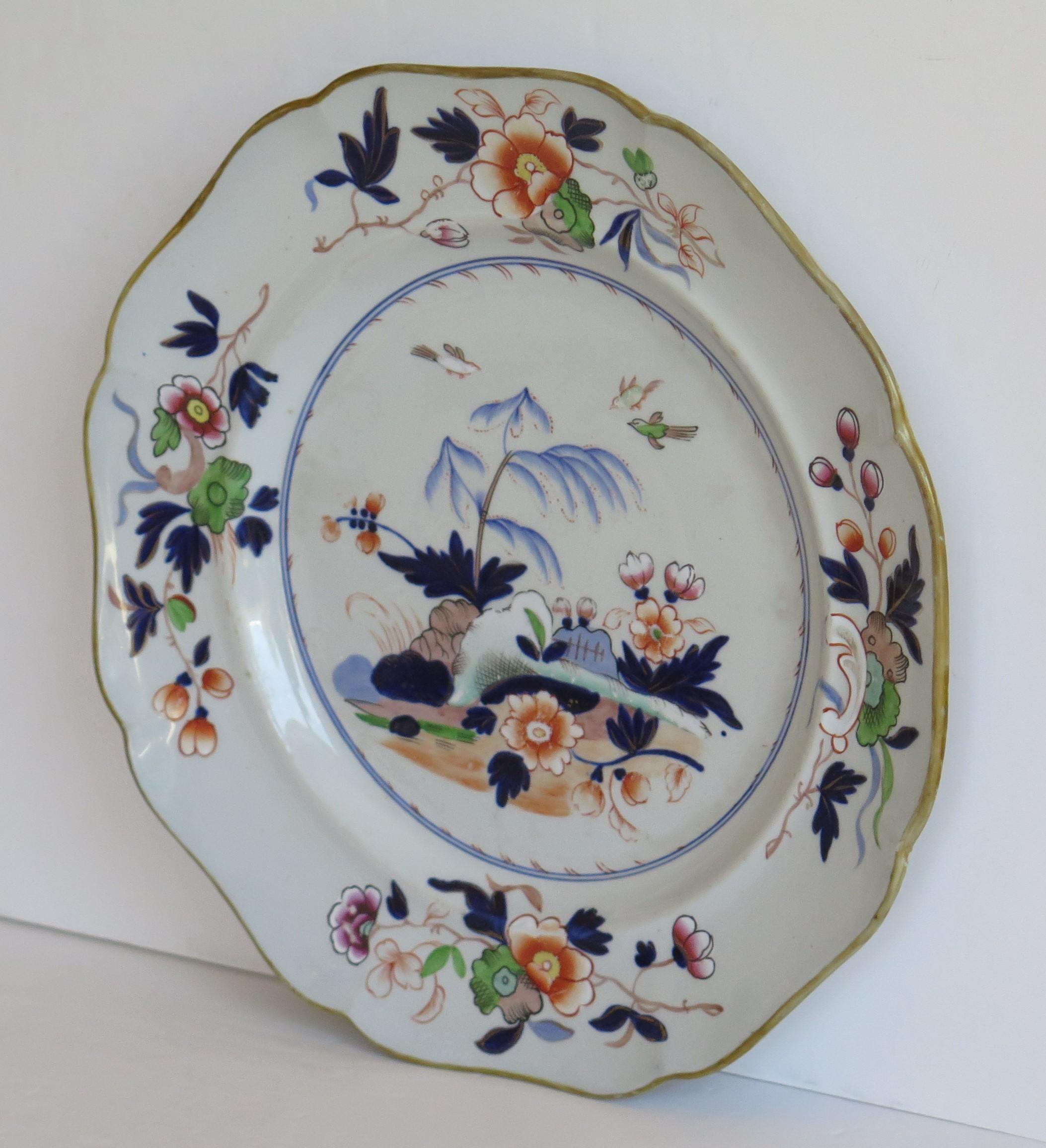 This is a very decorative, Imperial Stone China (ironstone), large Dinner Plate by John Ridgway, dating to the William IVth period of the 19th century.

The plate is potted in the Napier shape with a fluted wavy outer rim.

The plate has been
