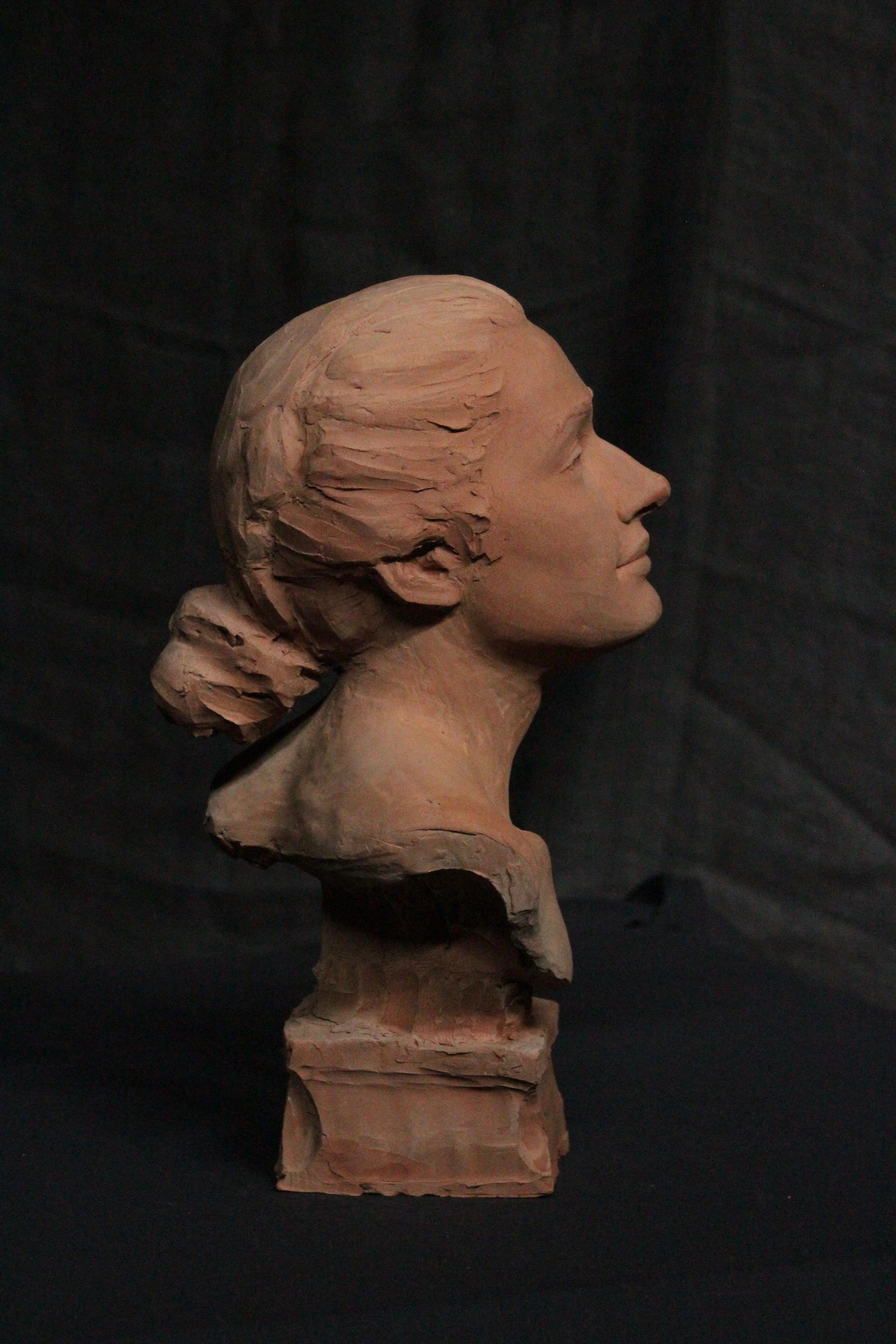 Scultura di testa di donna in terracotta 