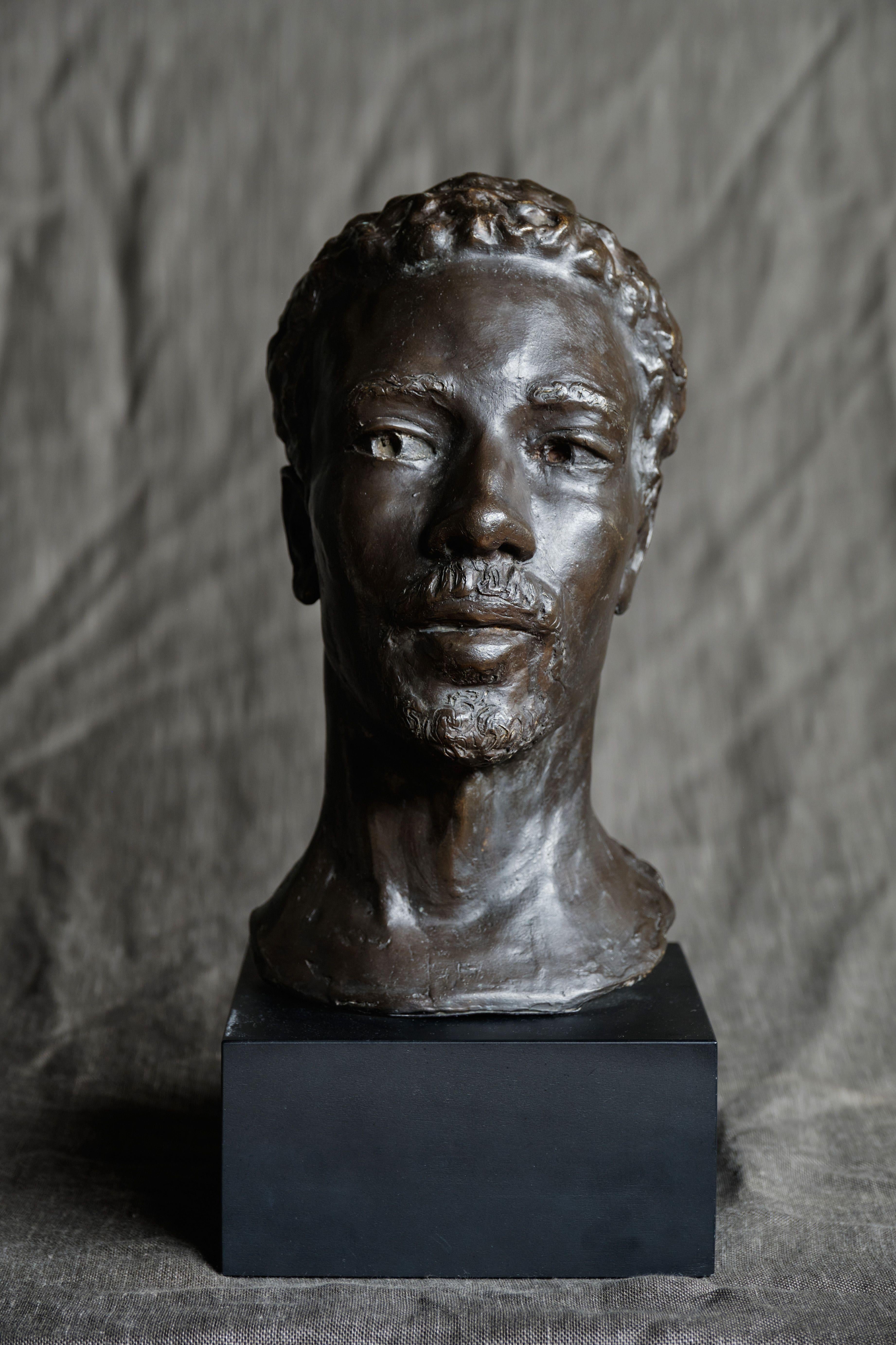 Bronze life-size male head with a dark brown patina.

Rushton sculpts all of his busts using live models over the course of multiple sittings. While realistic and classical in character, his sculptures also capture the individuality of the sitter.
