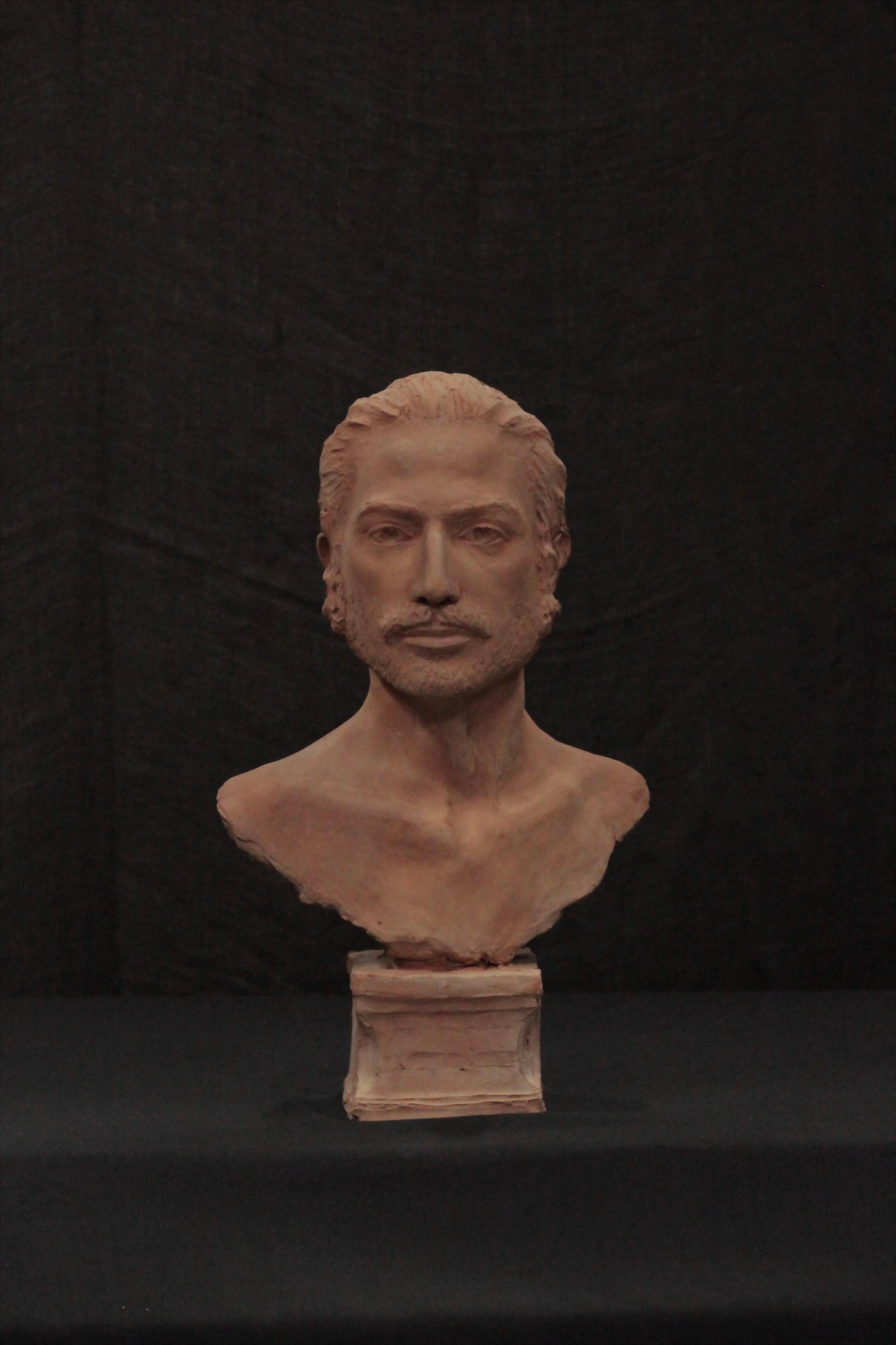 Scultura di testa maschile in terracotta 