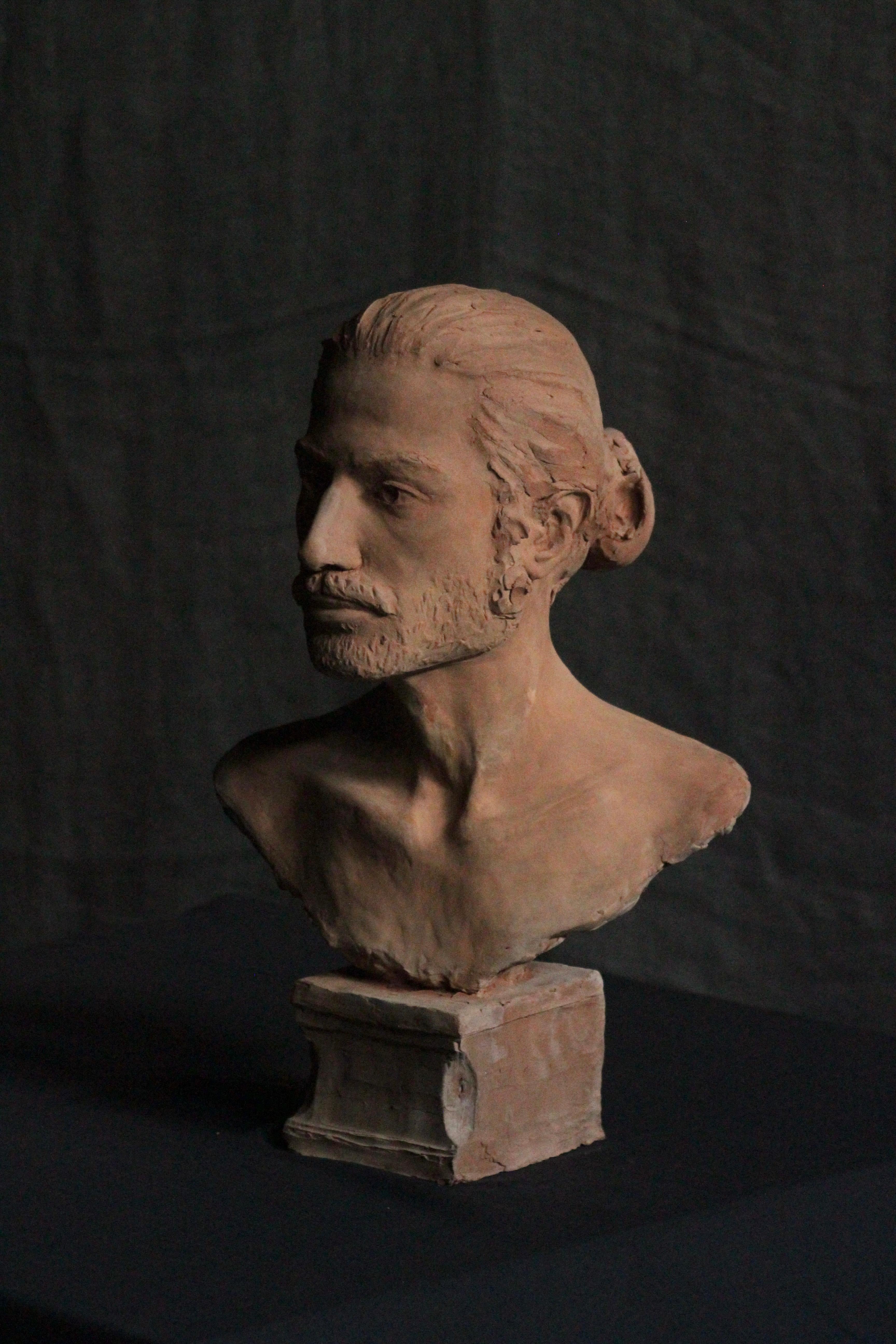 Scultura di testa maschile in terracotta 
