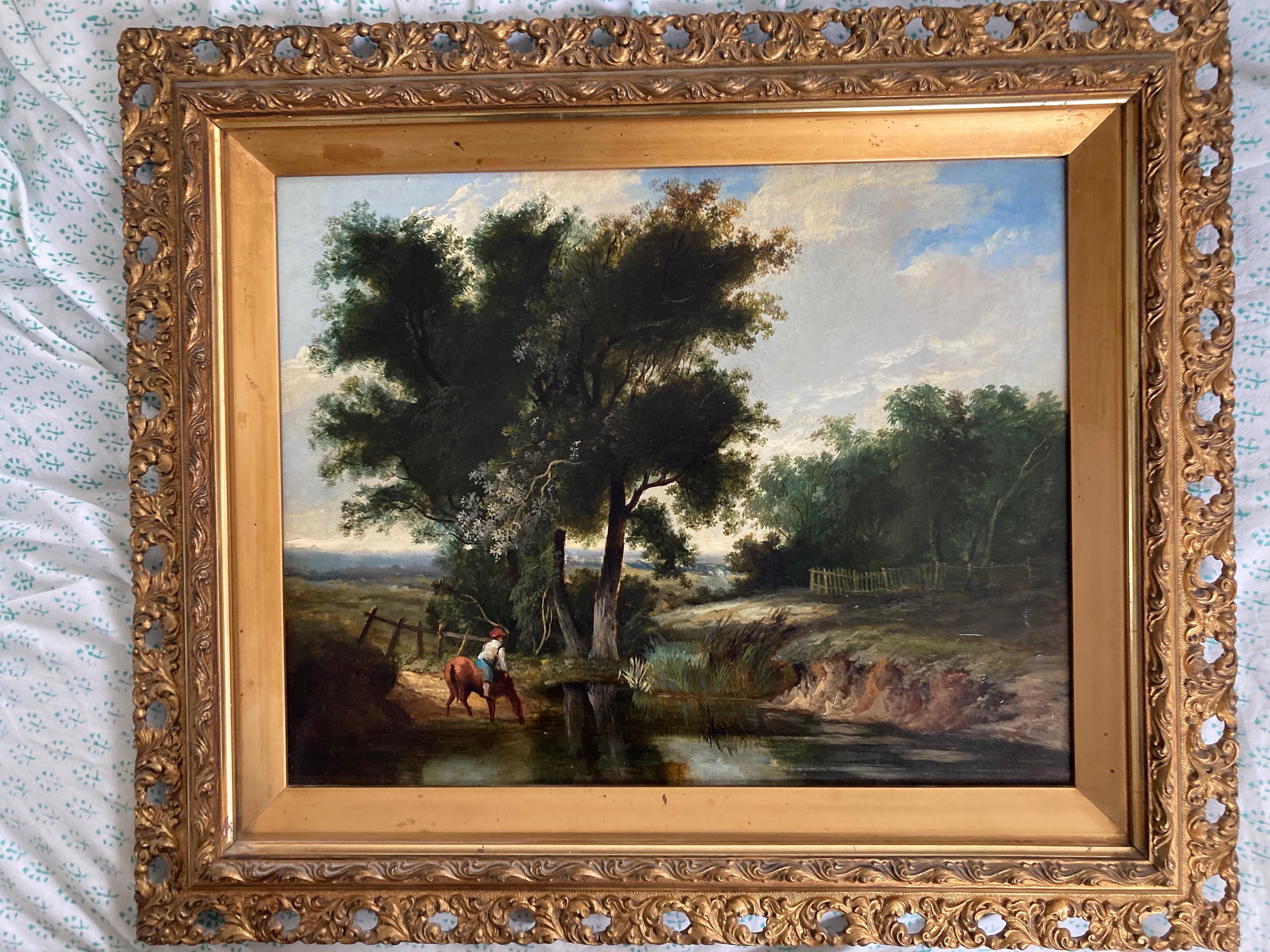 A charming rustic scene with a rider and his horse pausing on the banks of a brook.

Follower of William Joseph Shayer , mid 19th Century
A rider and his horse at a watering place
Oil on board
12 x 15 inches
17¾ x 21 inches including the