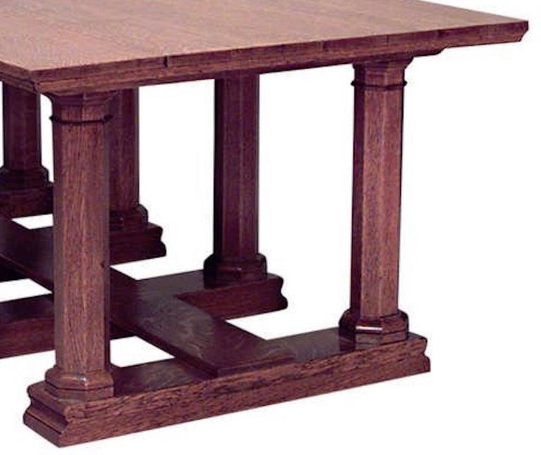 English Aesthetic Movement oak refectory dining table with plank top on 8 octagonal columnar legs joined by a stretcher (attributed to WILLIAM LETHABY).
