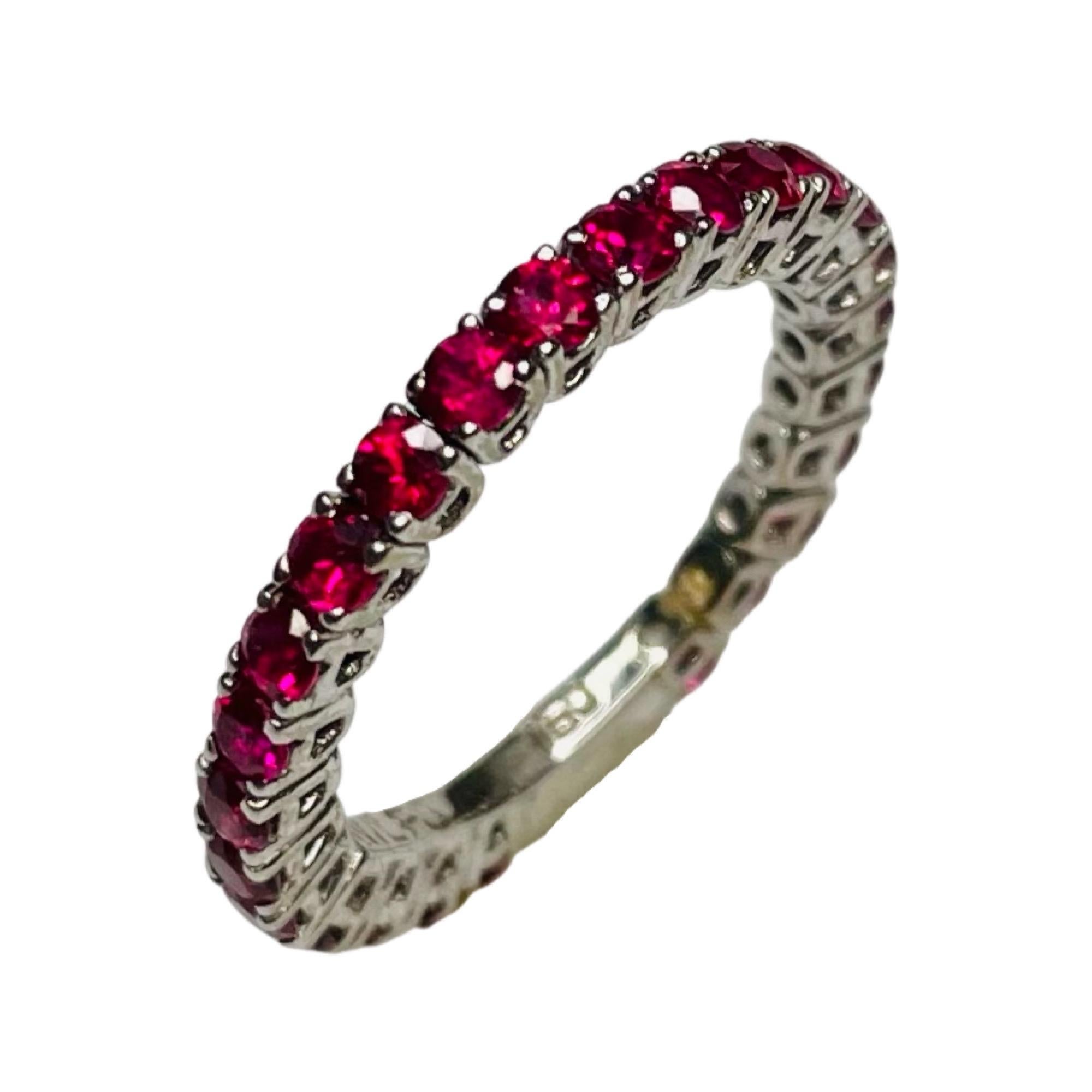 William Levine Fine Jewels 18K White Gold Natural Ruby Ring. There are 25, diamond cut Rubies weighing 1.59 carats. They are prong set. The ring is 2.2 mm wide. The ring is finger size 6 but can be sized for an additional fee. 
100-50-895