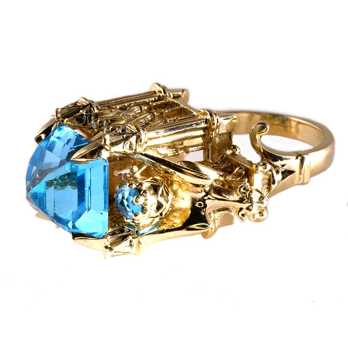 The Alchemist Ring is a wondrous one of a kind piece and fits a size 12 1/4 (Australian & British size Y 1/2).

Handcrafted in 9ct yellow gold this glorious ring features a central 15mm, square topaz, get atop a signature William Llewellyn Griffiths