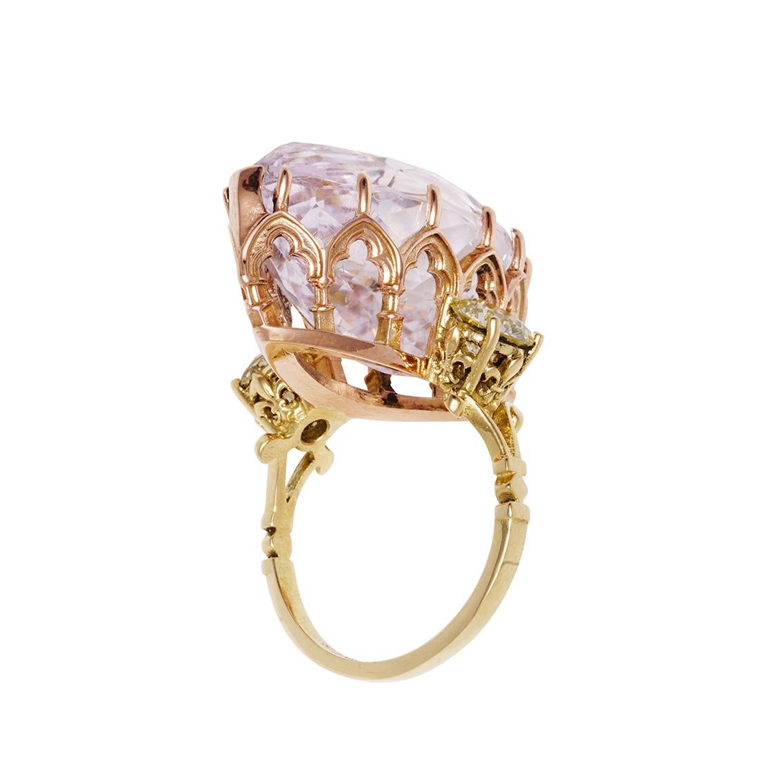 This vibrant ring is glorious in all its majesty, is one of a kind and suitable for the finest enchanters. 

Handmade in 18kt yellow and 18kt rose gold the ring features an enormous, marquise cut, morganite, claw set, approximately 20ct in weight