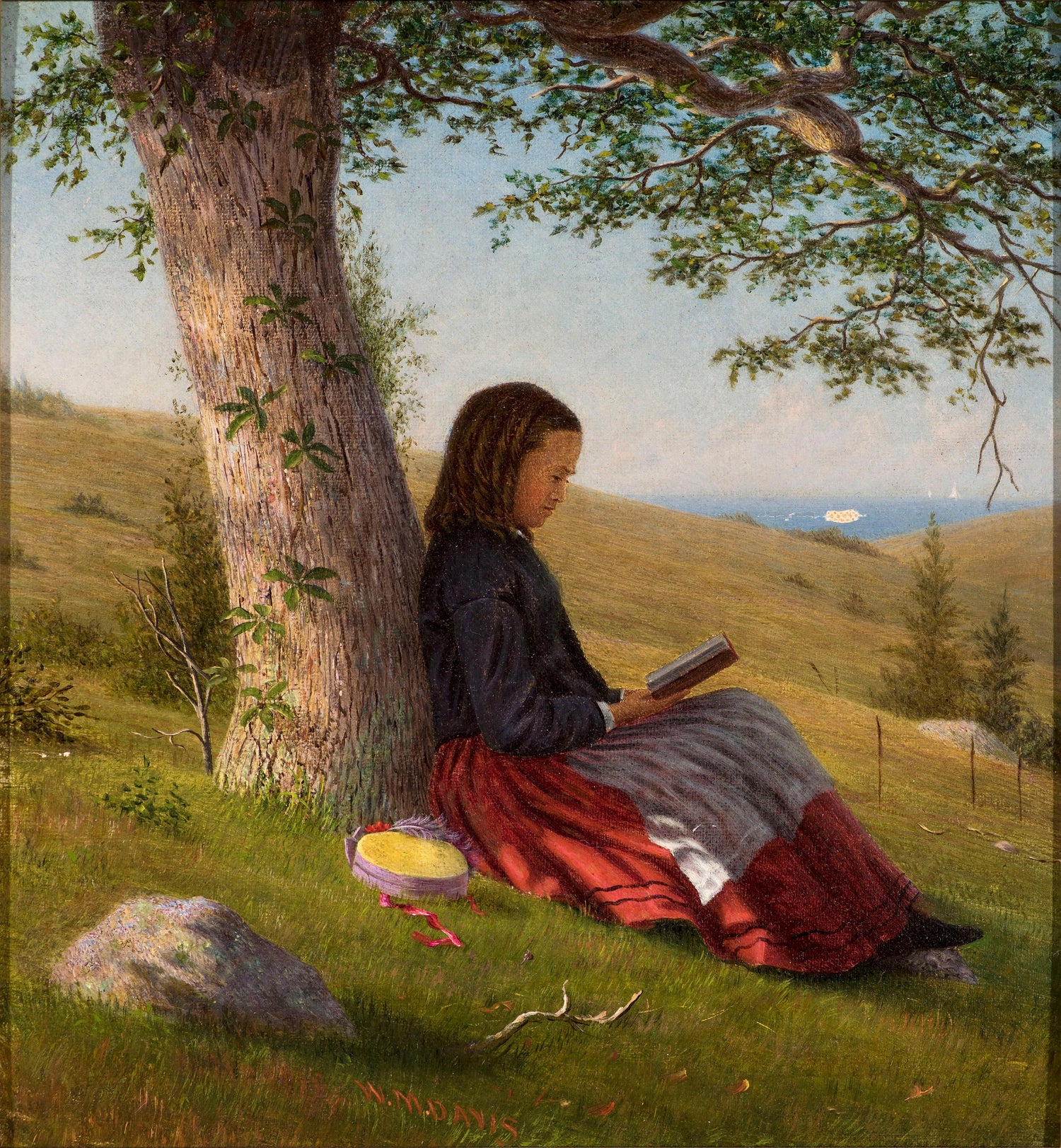 Young Girl Reading By A Tree