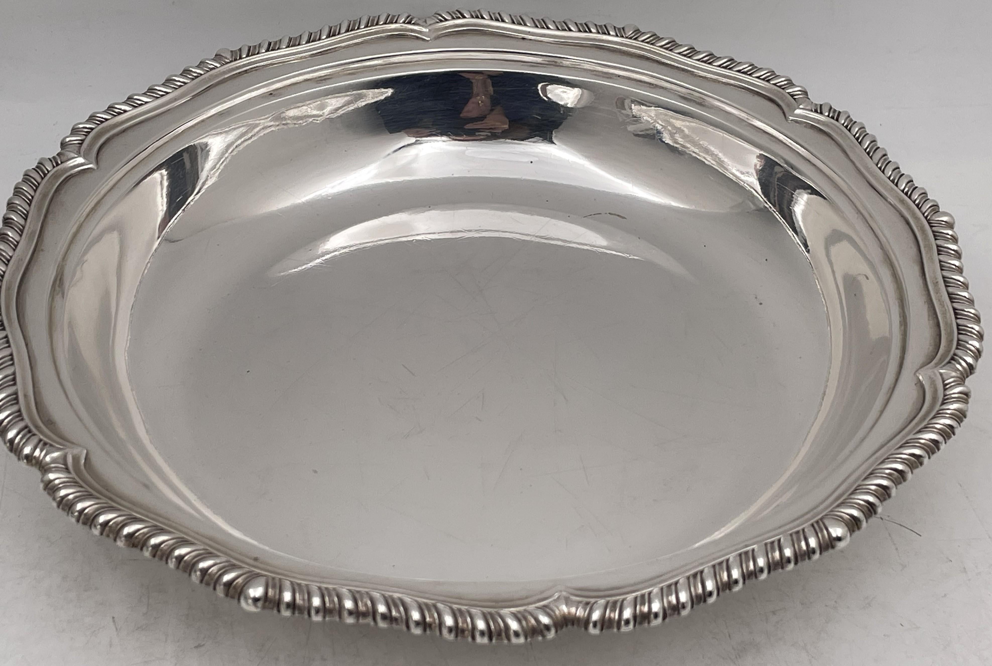 William Mann, English sterling silver covered bowl or dish from the Victorian era ; the bowl is from 1846 and the lid is from 1858. This beautifully shaped covered bowl exhibits the Latin motto of John Rolle, a member of the House of Lords: 