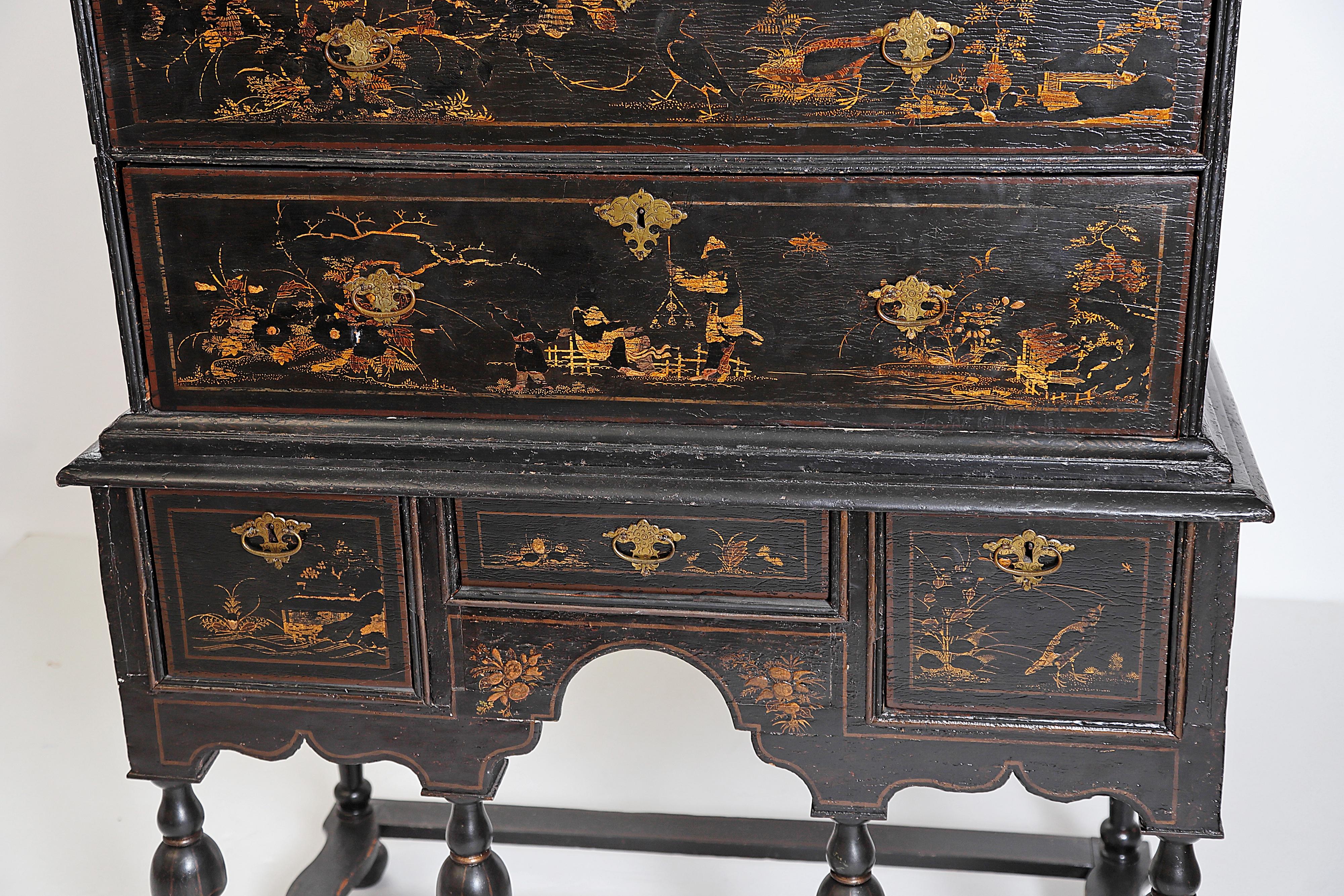 Late 17th-early 18th century William and Mary chest on stand with gilt chinoiserie decoration, Japanned, raised gilt decoration missing and worn in places, especially heads and bodies of people, flowers and leaves, and birds (see attached images),