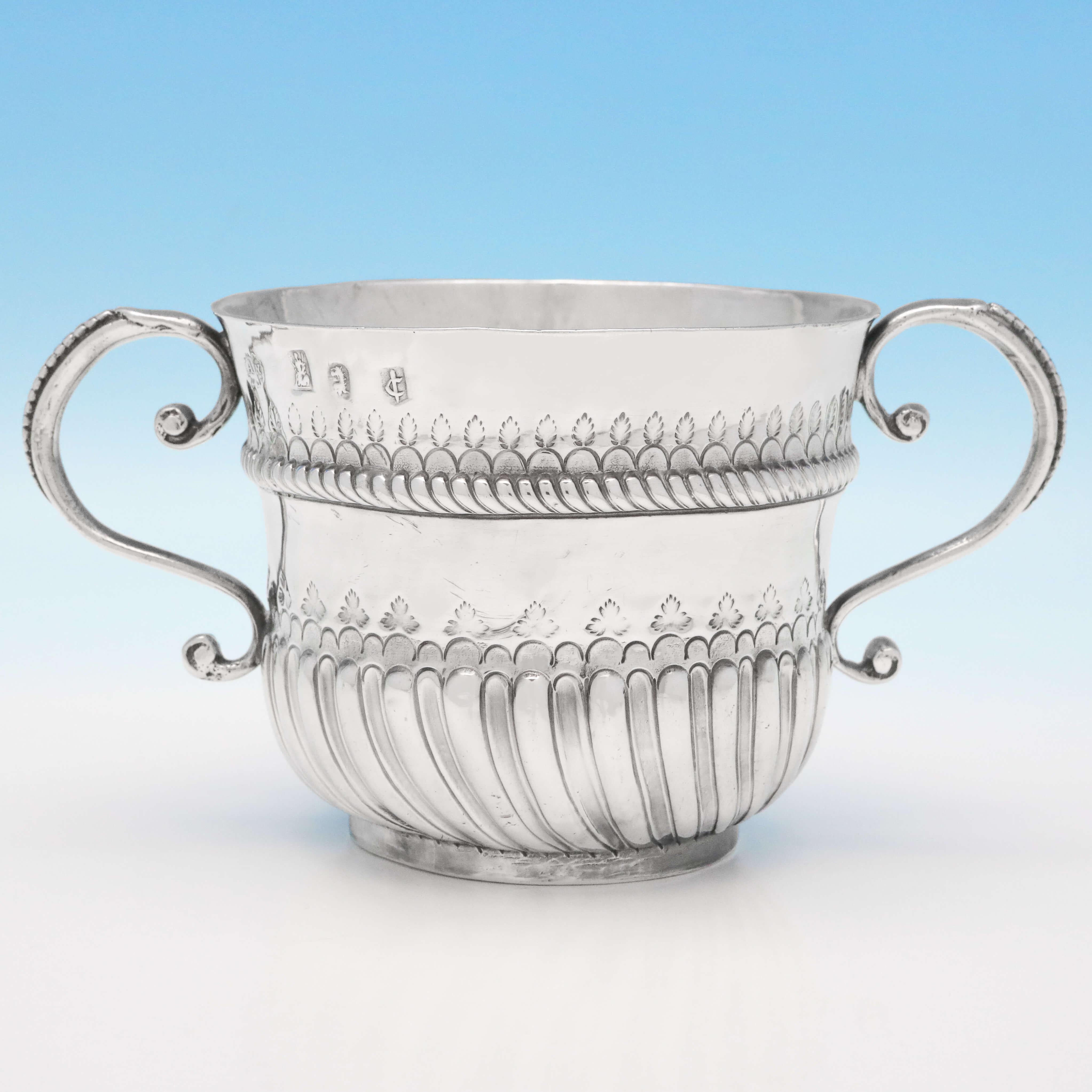 Hallmarked in London in 1698 by William Andrews, this exemplary, William & Mary Period, antique Brittania standard silver porringer, is in the traditional form, and is engraved with initials to one side (M.P). The porringer measures 3.5