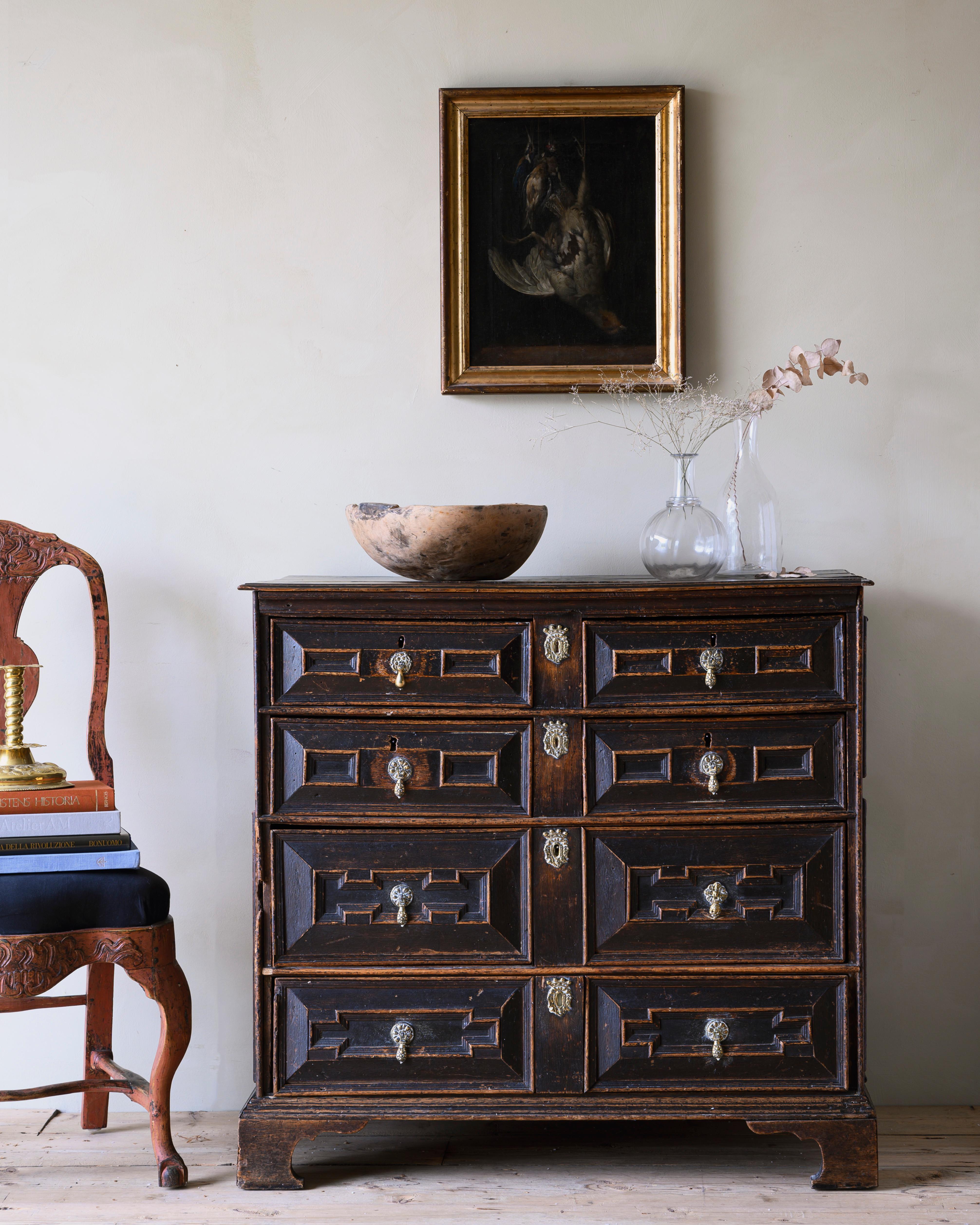 A good William & Mary Period Chest with six drawers with an exceptionally rich colour and patination and retaining historic blue sugar paper to the interior. An unusually fine and untouched example. English c. 1700.