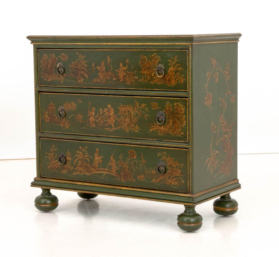 William and Mary Style Green Lacquered Chinoiserie Decorated Chest of Three Drawers, with gilt figural decoration atop four bun feet. 
28.25