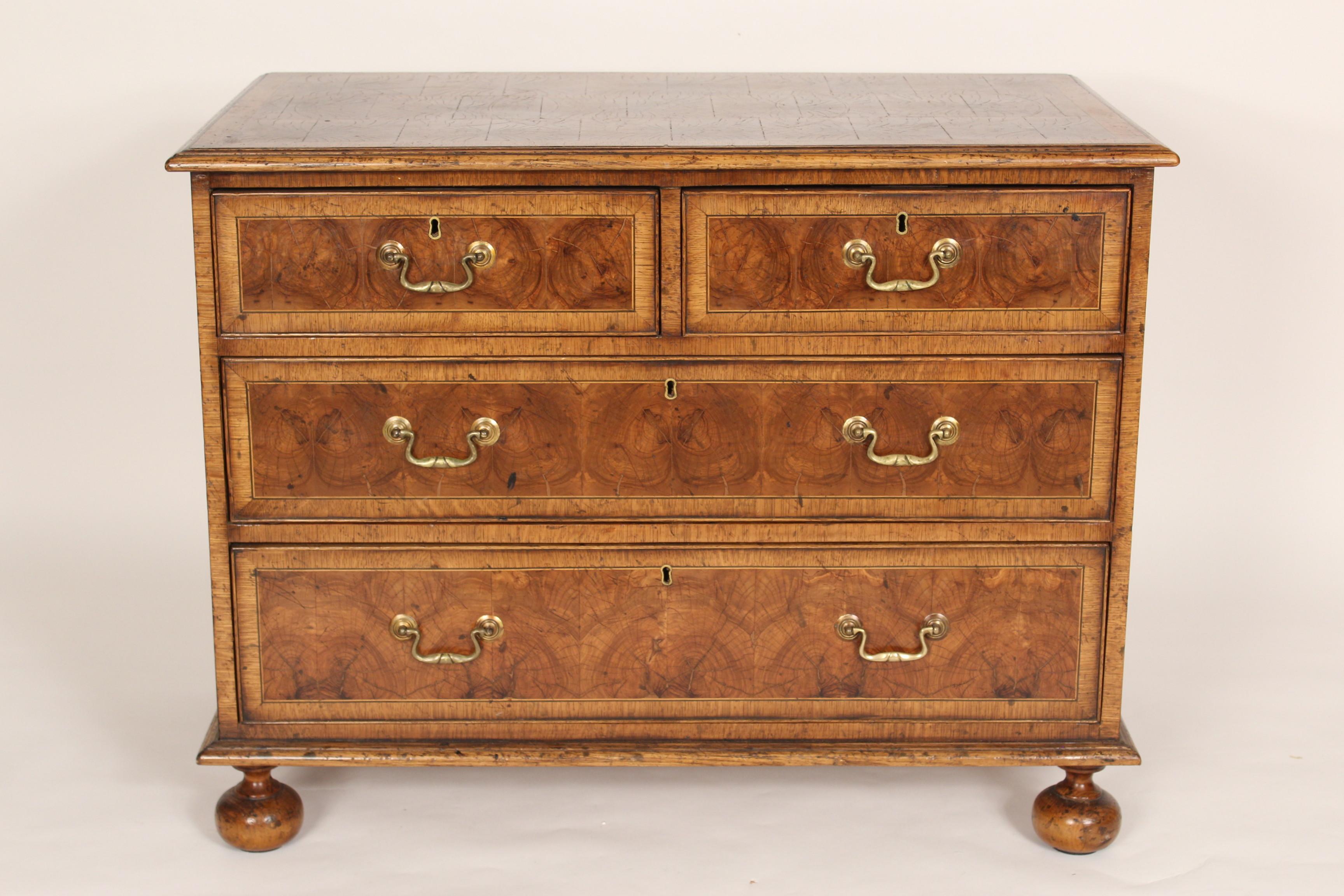 William & Mary style oyster burl chest of drawers, made in England, circa 1950's. With oak cross banding on top and front. Sides are oak with cross banded oak. Hand dove tailed drawer construction. Locks stamped made in England. The wood is