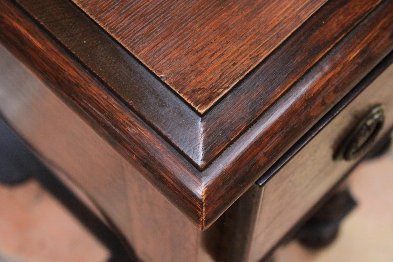 William & Mary style side table with three drawers and brass drops standing on Carolean inverted chalice legs with serpentine stretchers on bun feet.