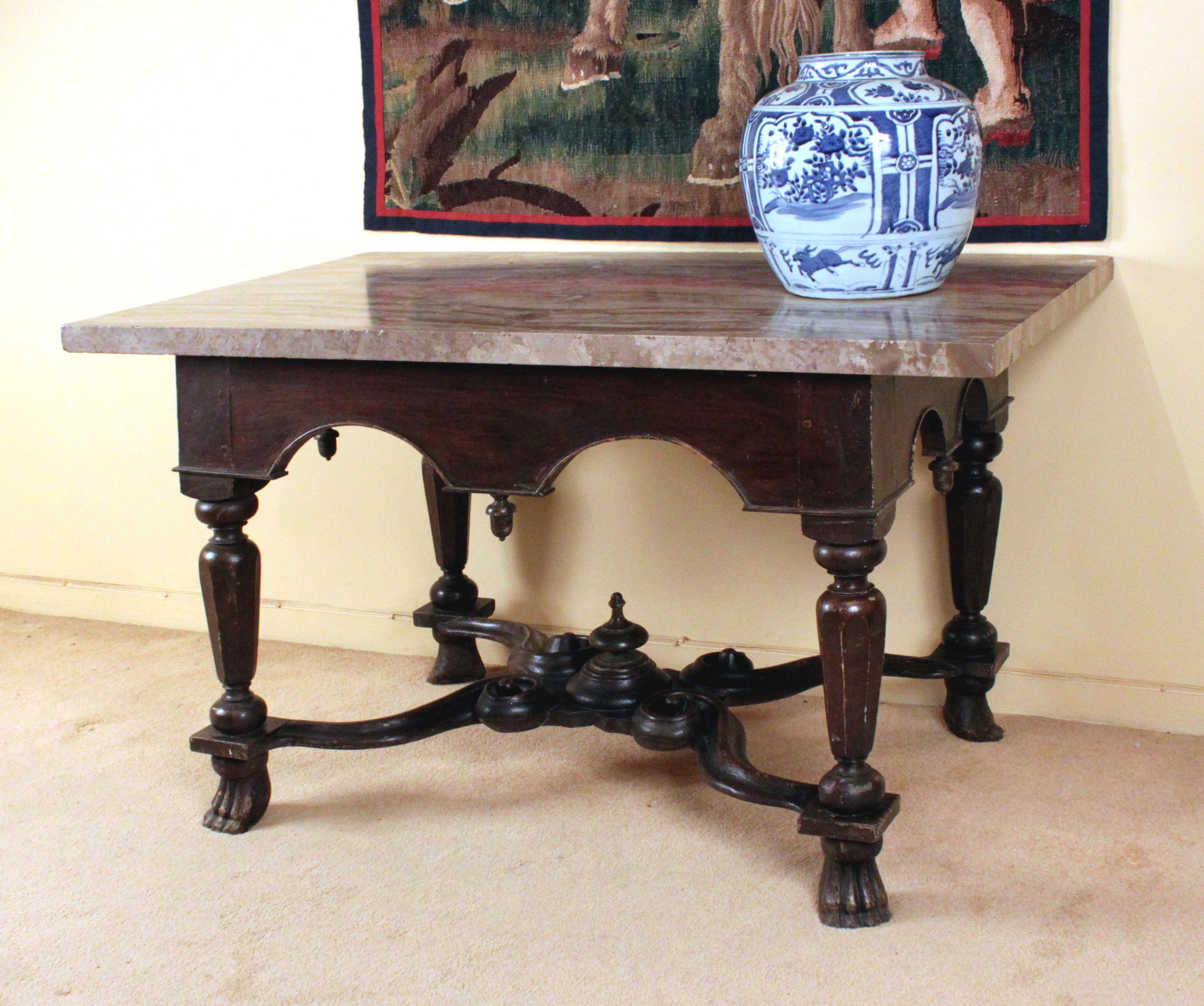 A very rare William & Mary pier table in the manner of Daniel Marot: shaped friezes on three sides and a scrolling X stretcher with Braganza feet: in its original simulated grained oak paint and with a Fine but associated marble top. This was