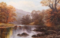 Precioso paisaje fluvial otoñal de estilo victoriano: ganado bebiendo bajo los árboles del bosque