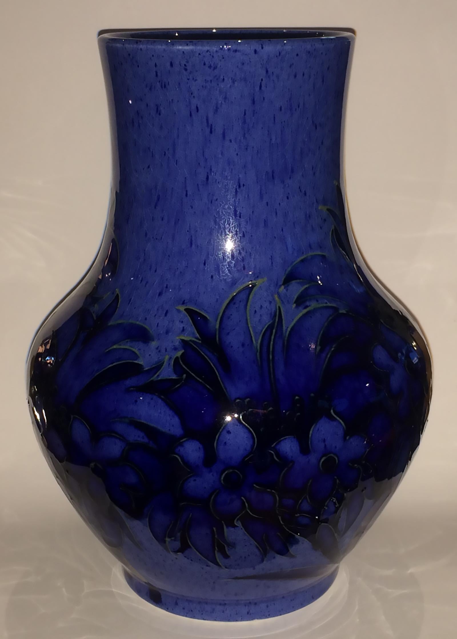 Art Deco vase by William Moorcroft, in cornflower blue and pattern. Totally in perfect condition with no chips, cracks or repairs. Finely detailed and marked to bottom: Moorcroft signature in dark blue script “WM”, “MADE IN ENGLAND” (impressed and