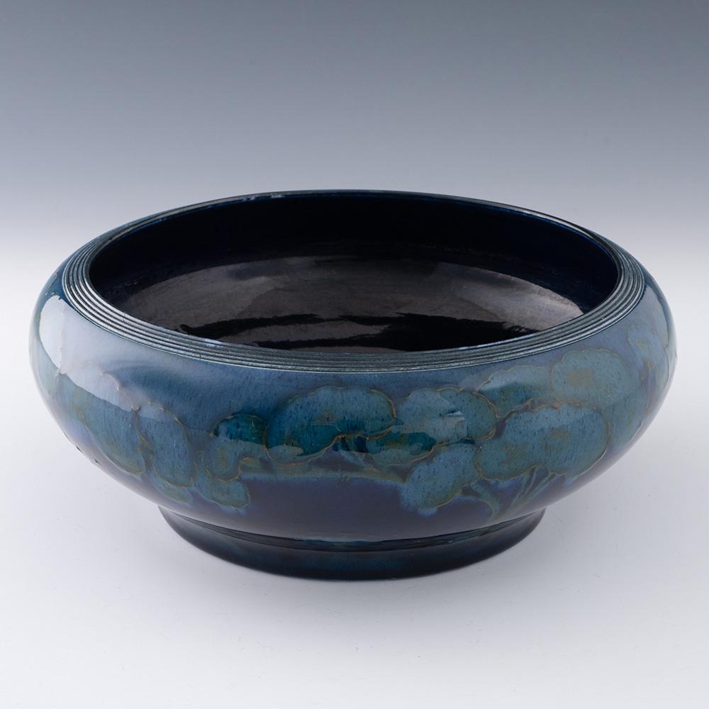 Heading : William Moorcroft Moonlit blue bowl c1925
Period : George V
Marks : MOORCROFT, MADE IN ENGLAND, and pattern number 1410
Origin : Burslem, Englnad
Colour : Various shades of blue and turquoise
Pattern : Moonlit Blue

Features : Reeded