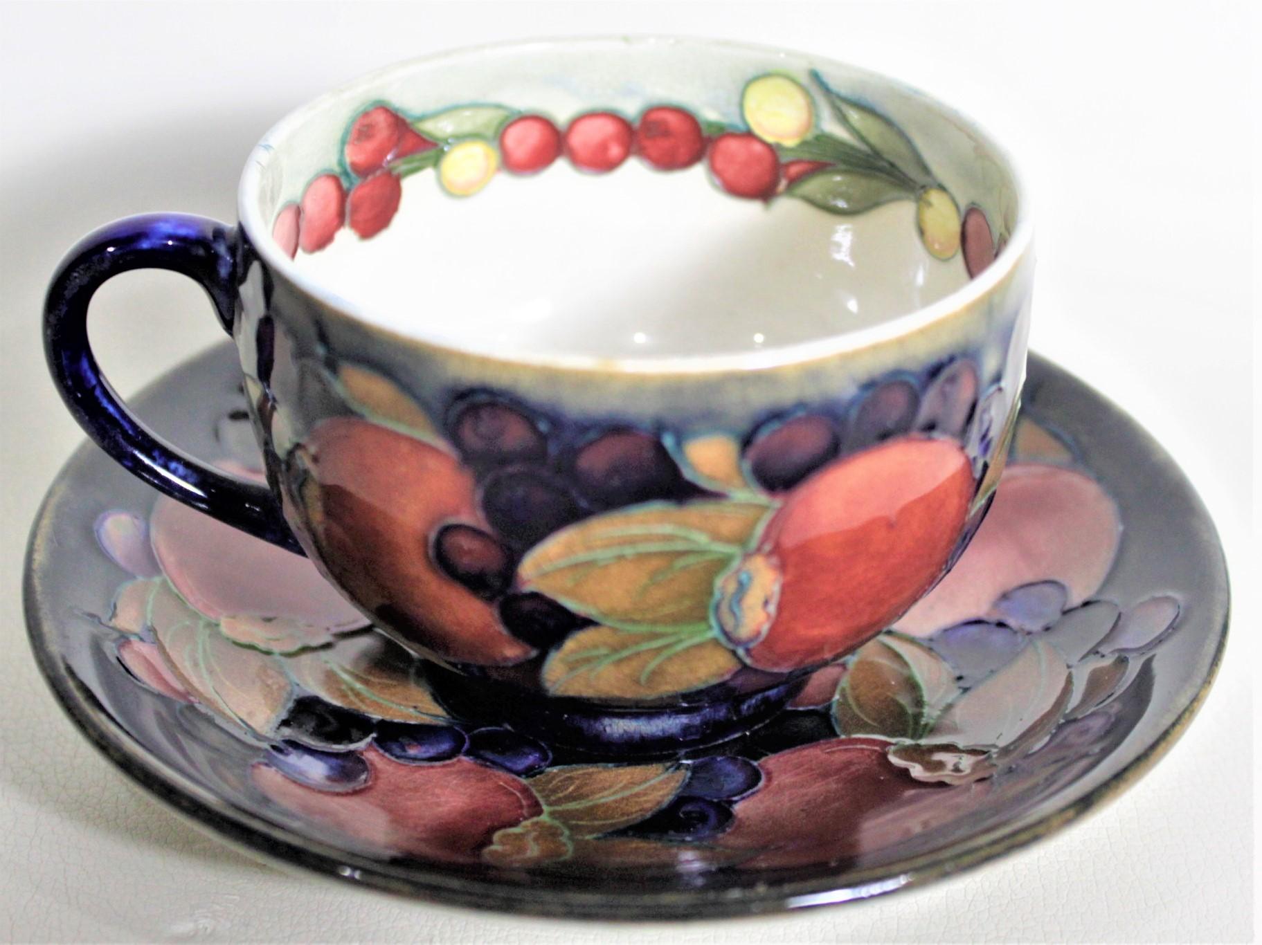 20th Century William Moorcroft Pomegranate Patterned Art Pottery Teacup & Saucer Set #1 of 4 For Sale