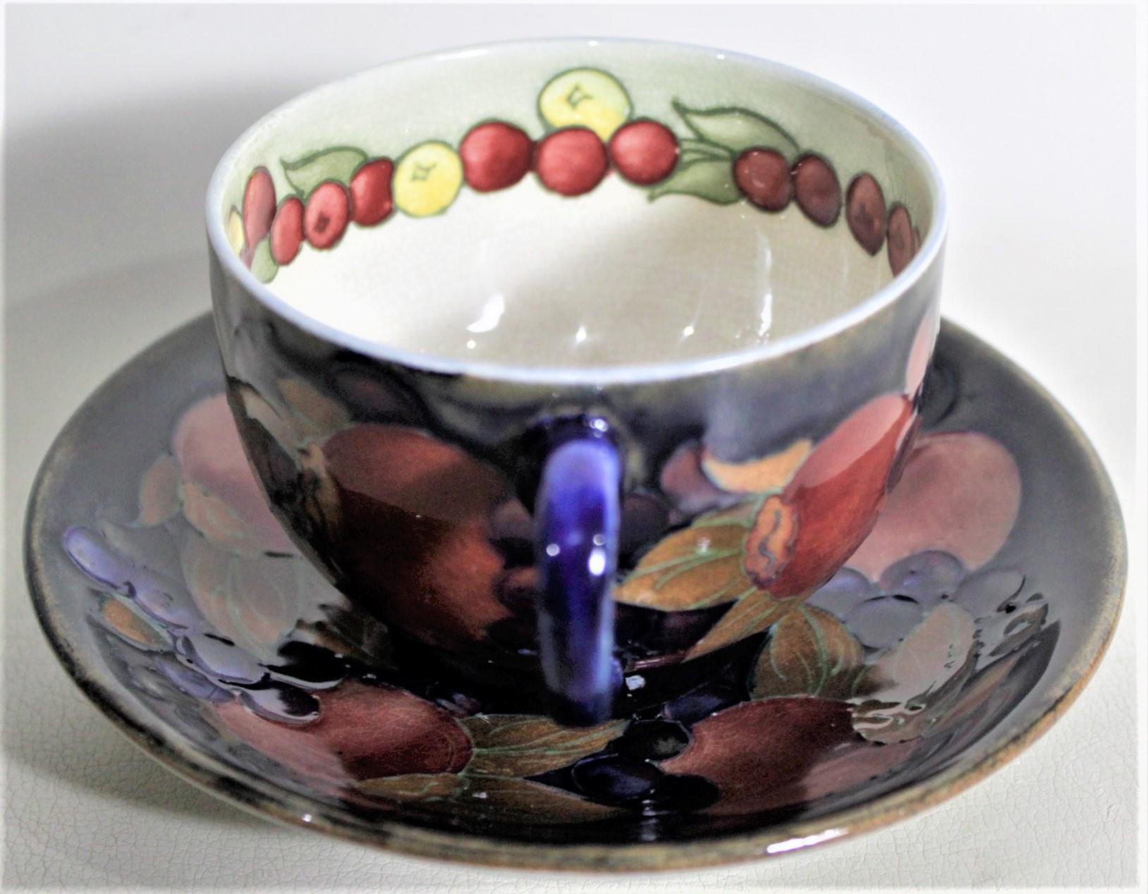 Hand-Crafted William Moorcroft Pomegranate Patterned Art Pottery Teacup & Saucer Set #1 of 4 For Sale