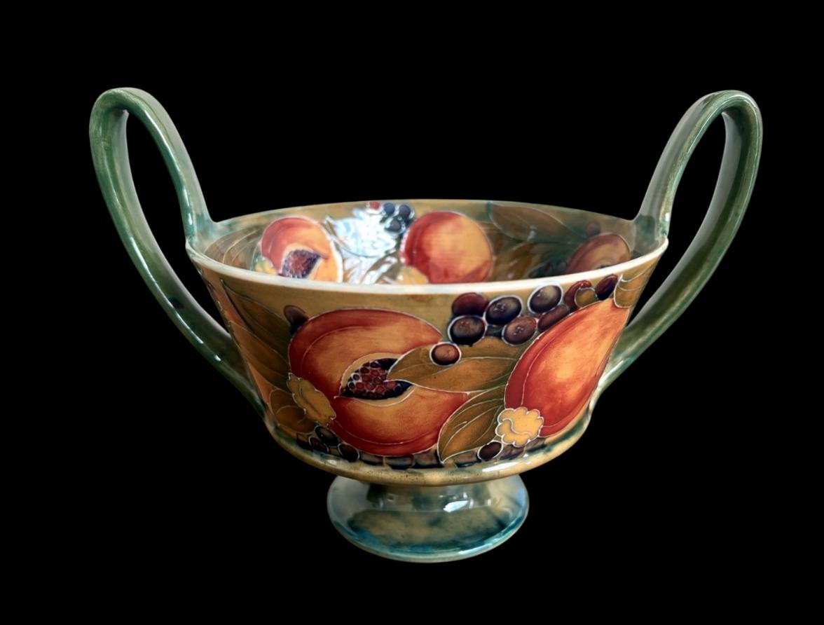 5270

William Moorcroft Two Handled Bowl decorated to the interior and exterior with the Pomegranate design on an Ochre Ground

Circa 1910

17cm high and 23cm wide

Complimentary Insured Postage
14 Day Money Back Guarantee
BADA Member –