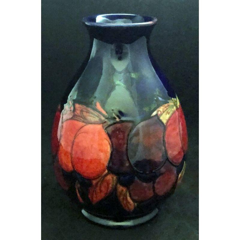 William Moorcroft vase decorated with Wisteria design in a Flambe glaze 1920s

Dimensions: 24.5cm high

Complimentary Insured Postage
14 Day Money Back Guarantee
BADA Member – Buy the Best from the Best.