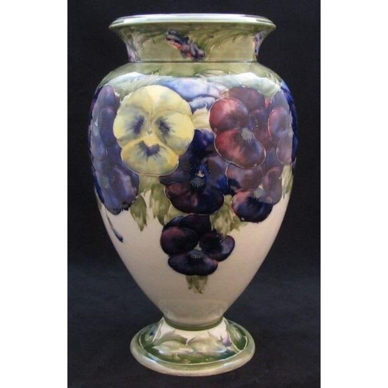 William Moorcroft vase decorated it the Pansy design on a white ground dated 1914. Undulations to foot rim from the removal from the kiln Dated: 1914

Dimensions: 34cm high

Complimentary Insured Postage
14 Day Money Back Guarantee
BADA Member