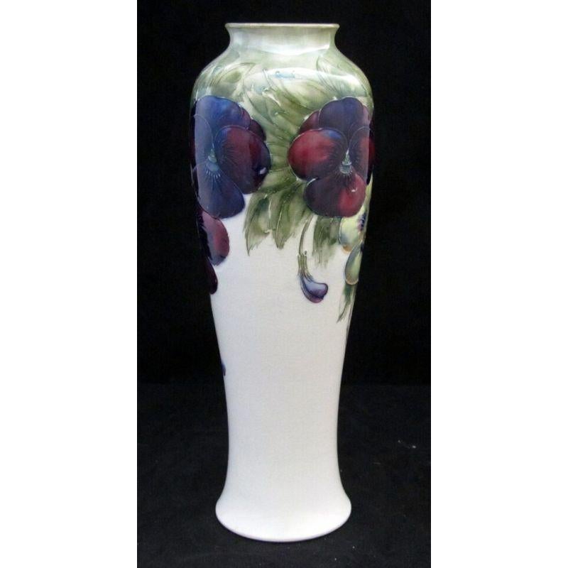 William Moorcroft vase decorated with the Pansy design on a white ground Circa 1915

Dimensions: 30cm high

Complimentary Insured Postage
14 Day Money Back Guarantee
BADA Member – Buy the Best from the Best.
