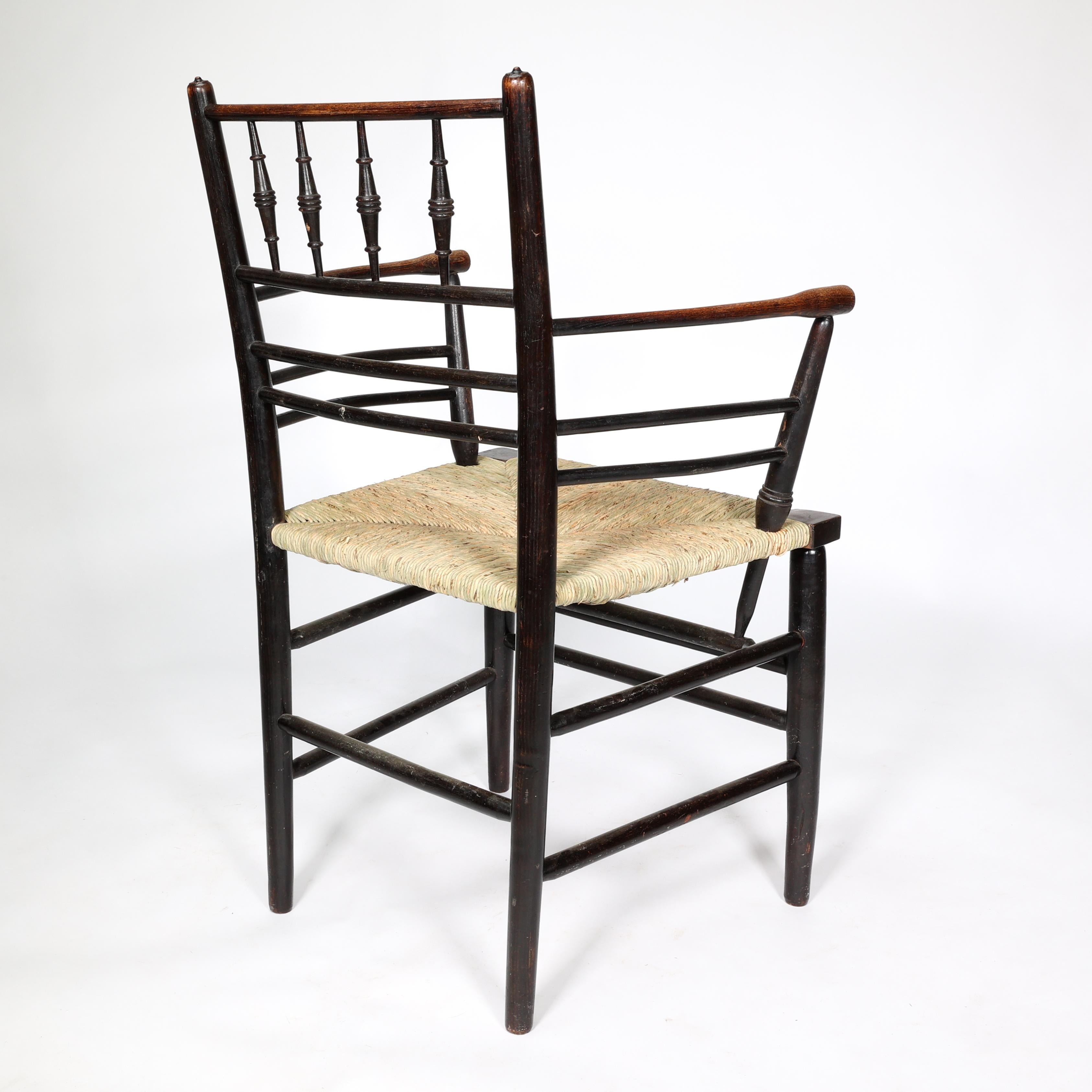 William Morris, A Classic Arts & Crafts Ebonised Armchair from the Sussex Range. 8