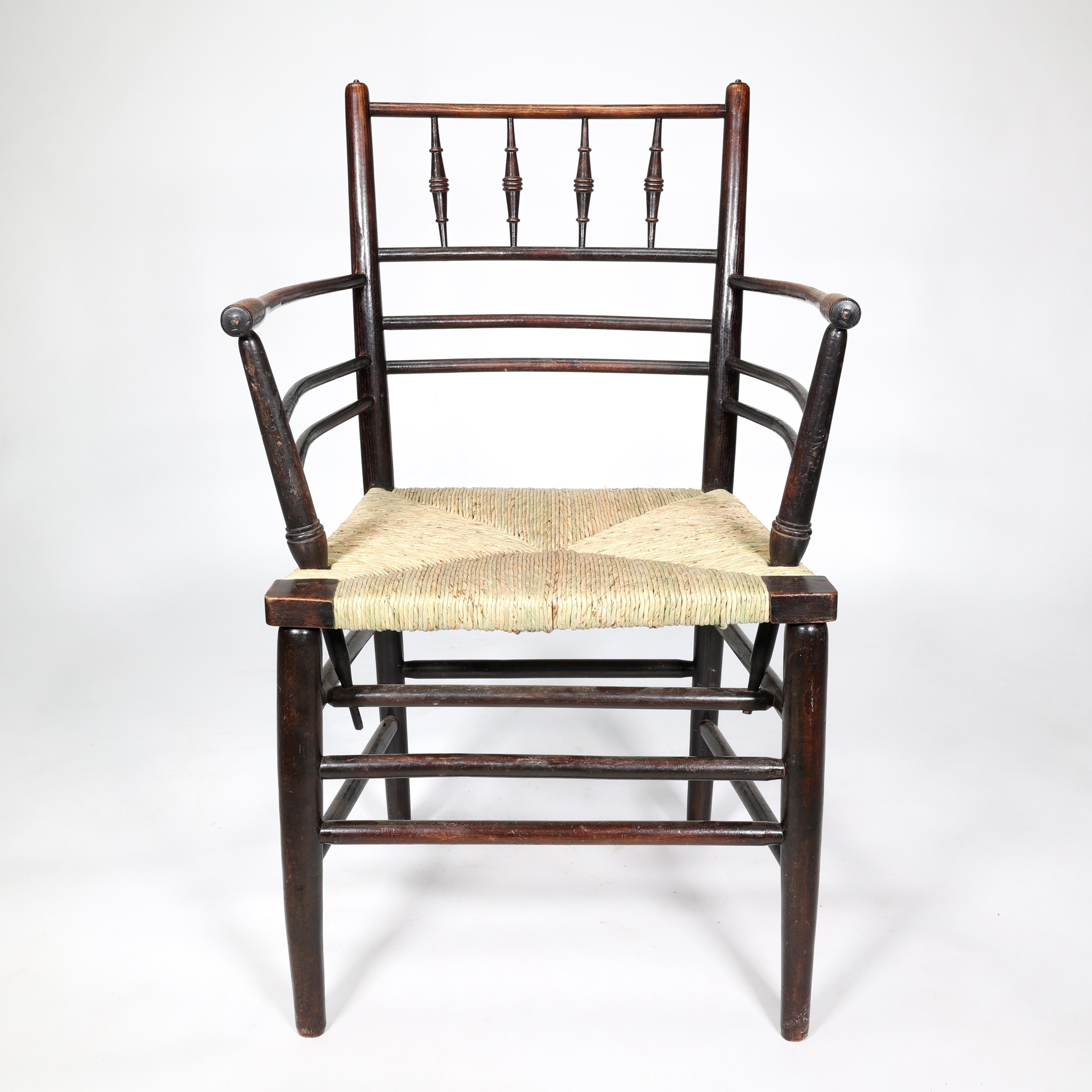 Arts and Crafts William Morris, A Classic Arts & Crafts Ebonised Armchair from the Sussex Range.