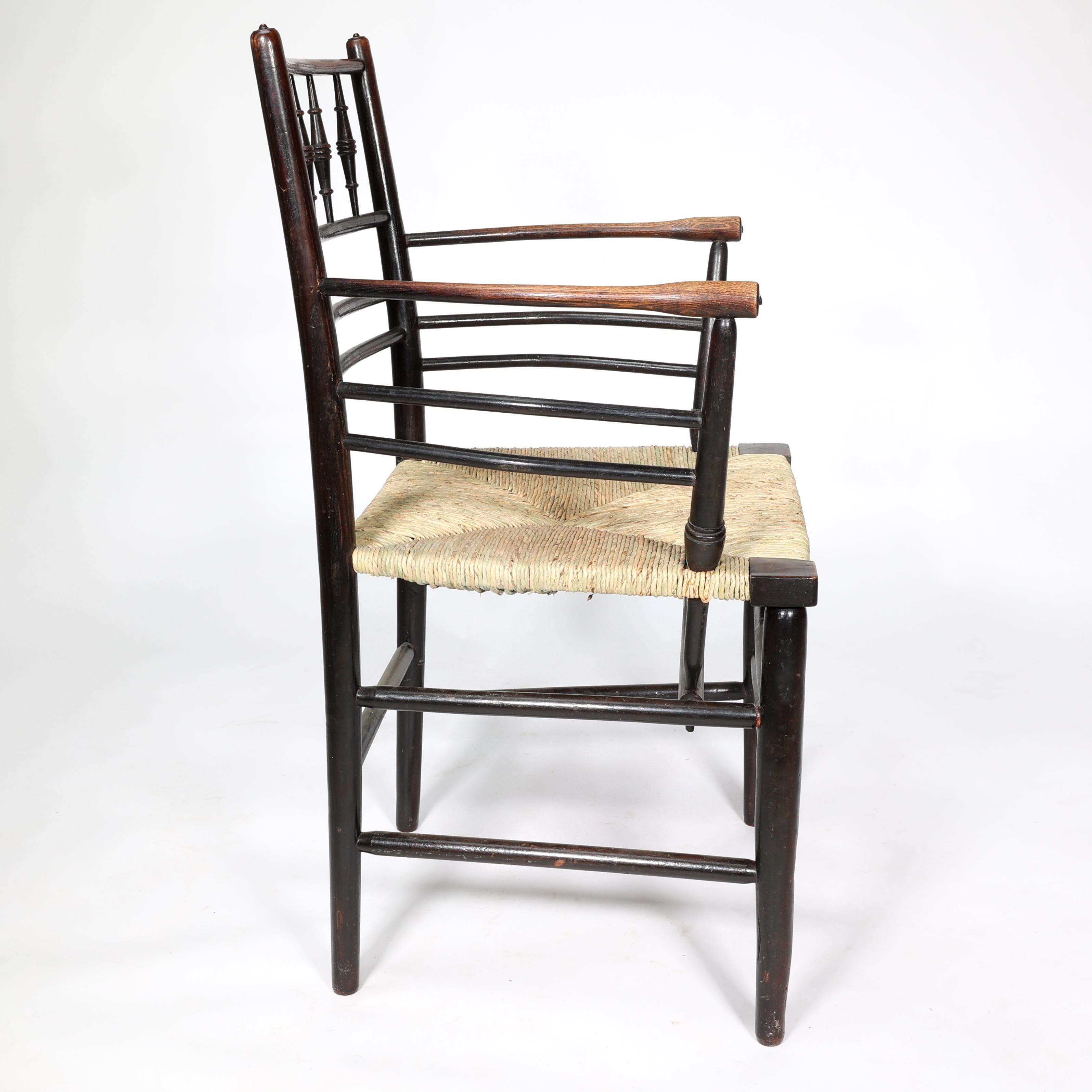 Ebonized William Morris, A Classic Arts & Crafts Ebonised Armchair from the Sussex Range.