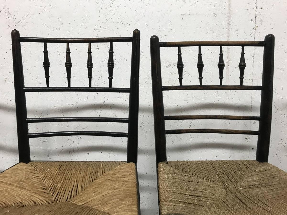 William Morris, Five Ebonized Rush Seat Sussex Side Chairs and Matching Armchair 7