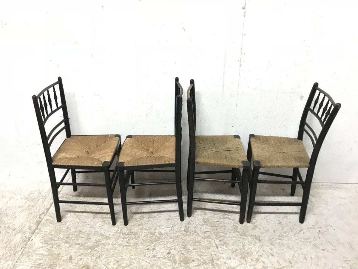 William Morris, Five Ebonized Rush Seat Sussex Side Chairs and Matching Armchair 10