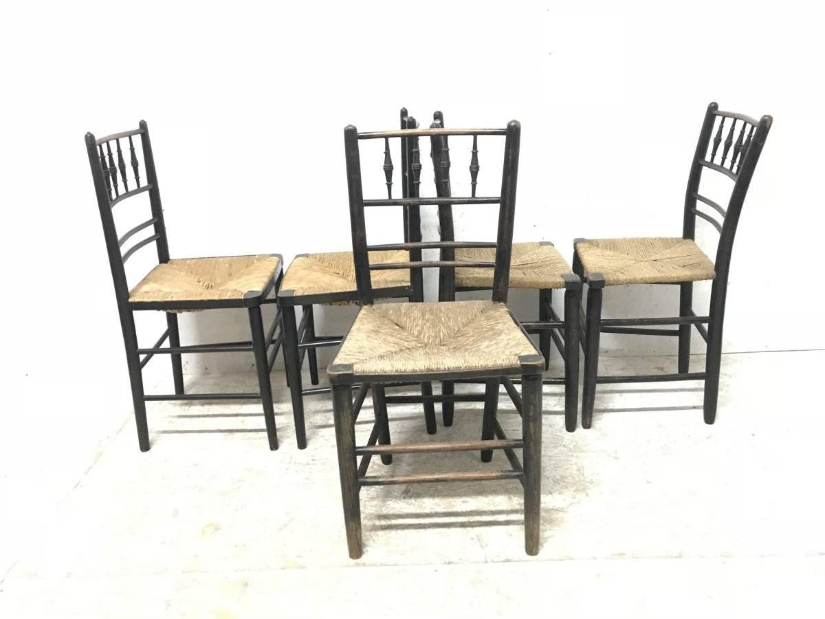 William Morris, Five Ebonized Rush Seat Sussex Side Chairs and Matching Armchair 11
