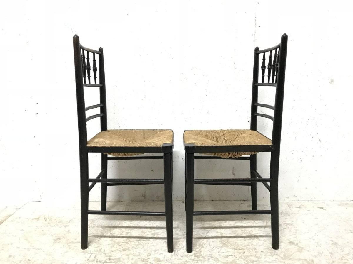 Beech William Morris, Five Ebonized Rush Seat Sussex Side Chairs and Matching Armchair