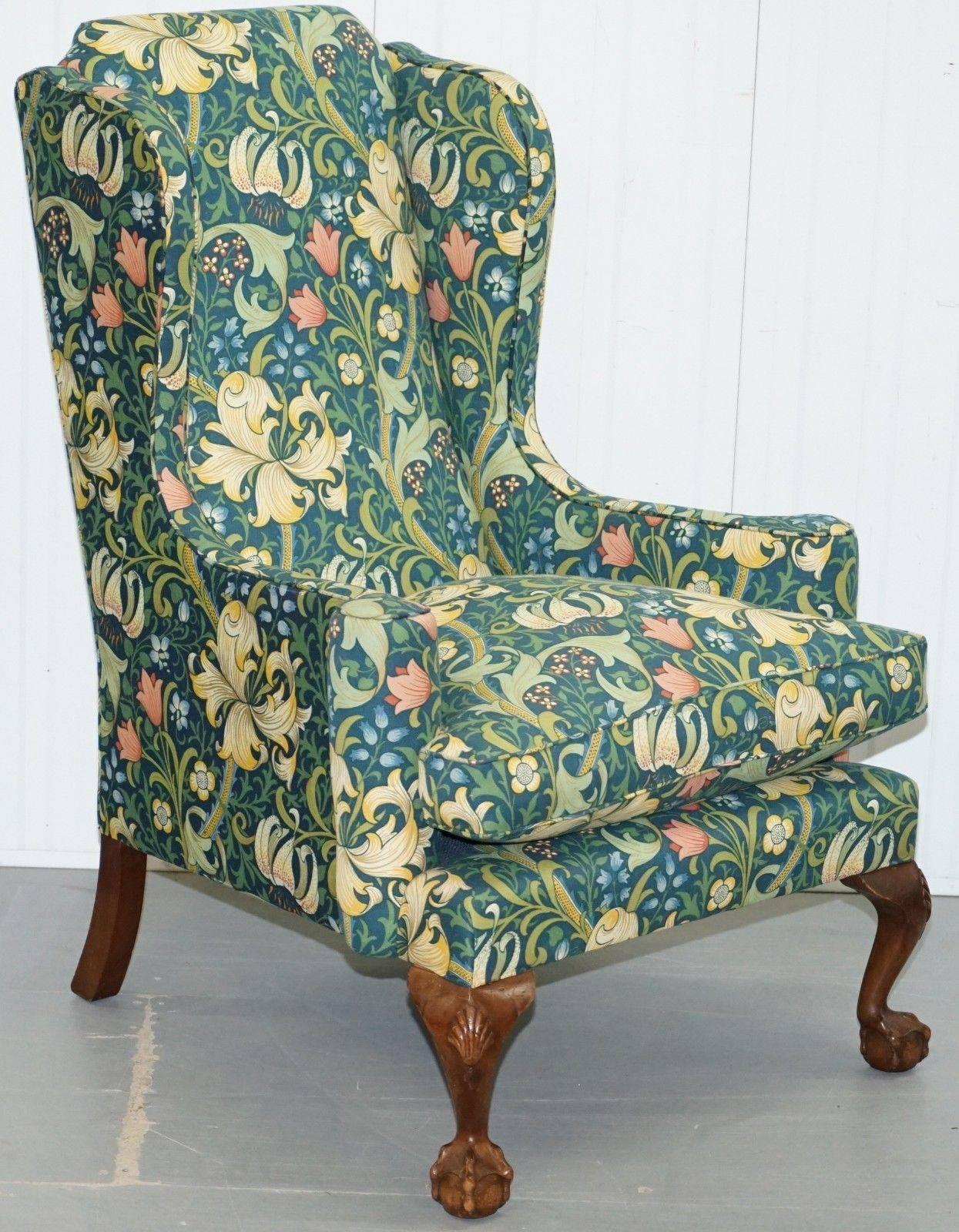 We are delighted to offer for sale this stunning Walnut framed William Morris Golden Lily upholstered Georgian Irish style Victorian Wingback armchair and stool

A very large grand wingback armchair with a lovely slightly laid-back seating